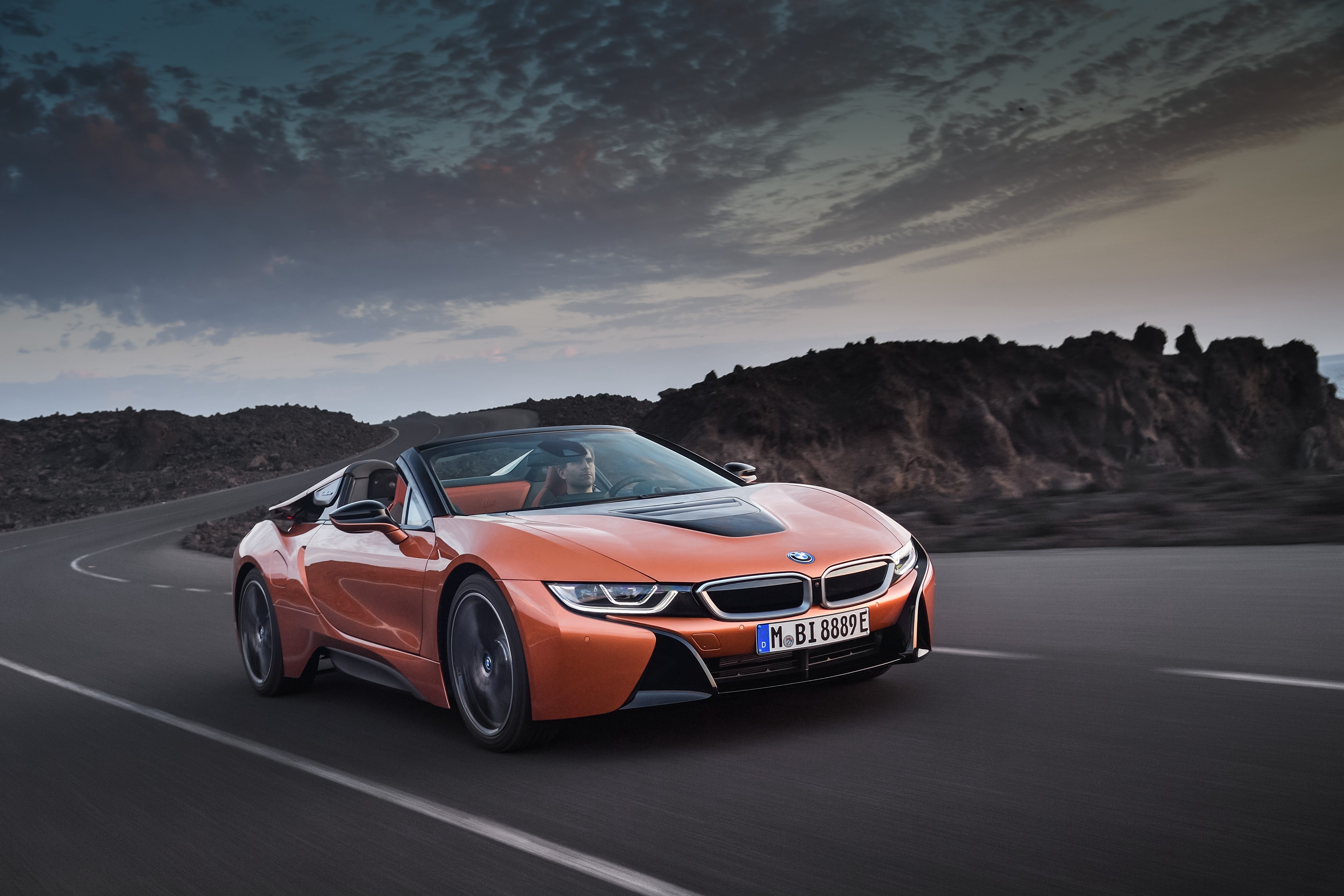 2018 BMW i8 Roadster in motion on a road HD Wallpaper