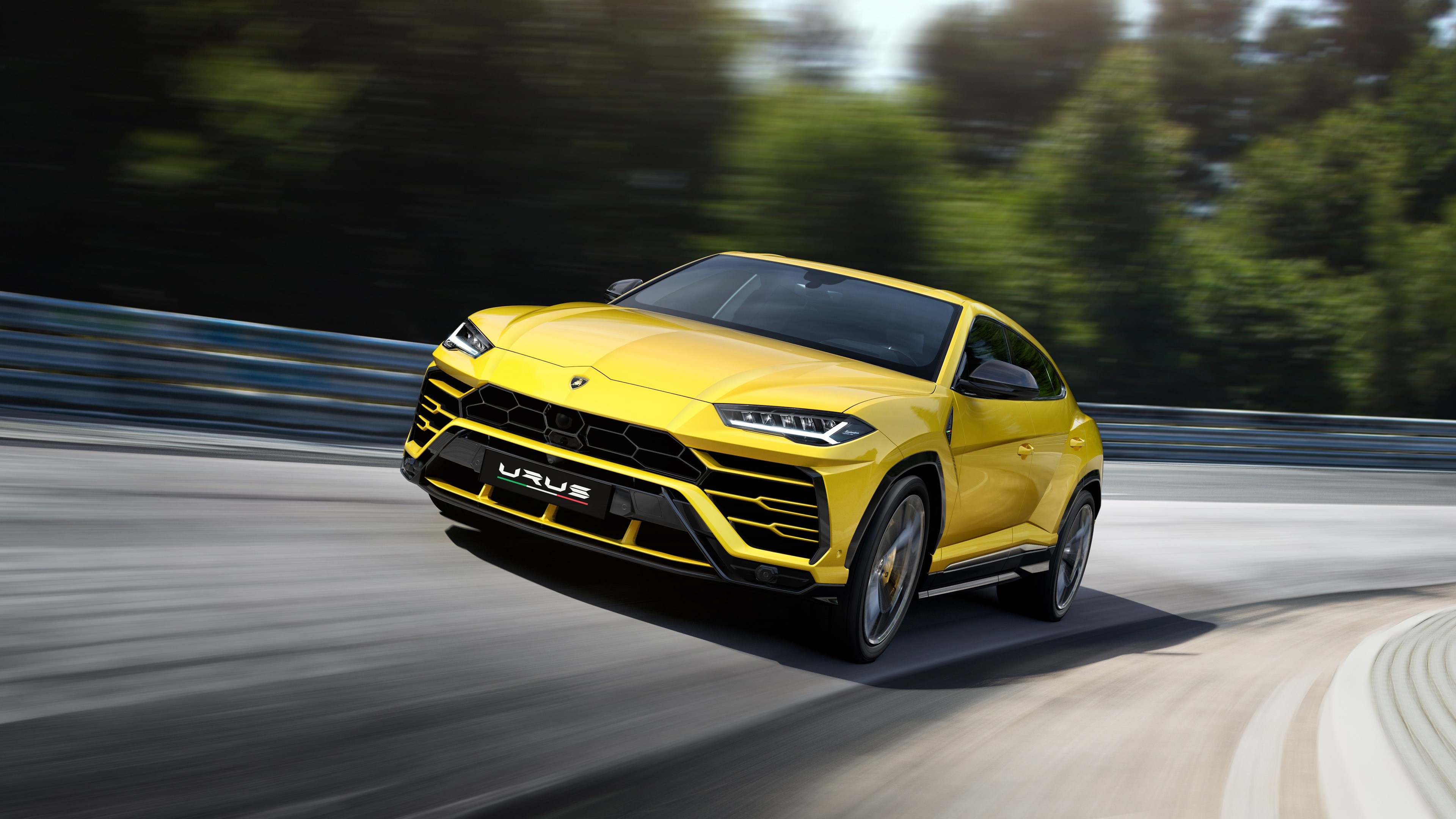 Yellow Lamborghini Urus 2018 on a Racetrack HD Wallpaper