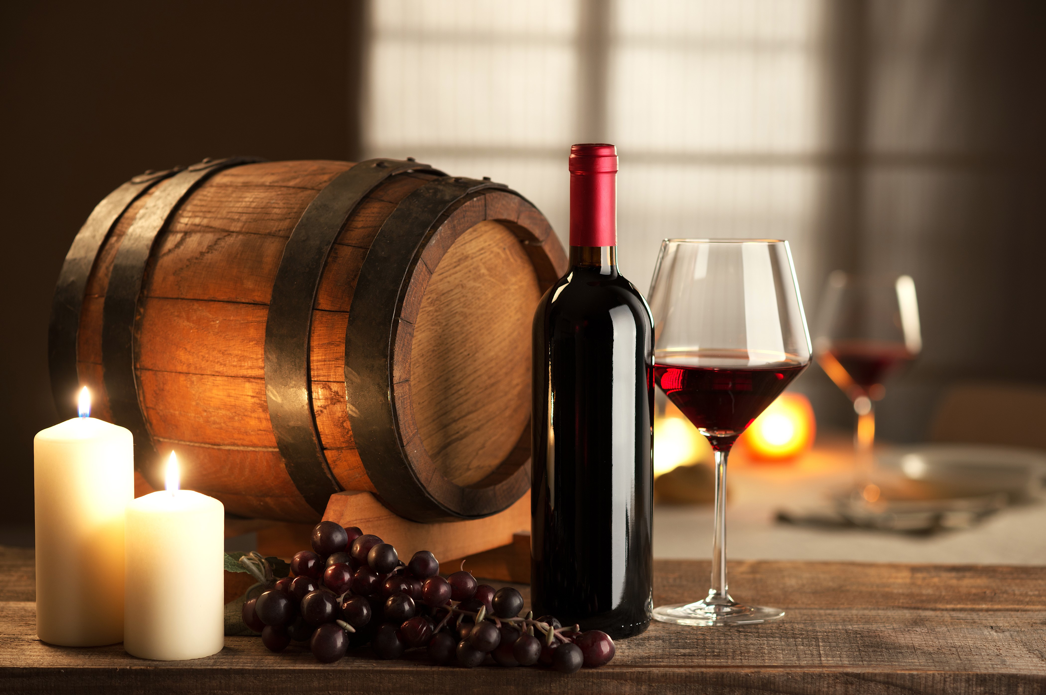 Wine barrel, grapes, candles, and wine bottle HD Wallpaper