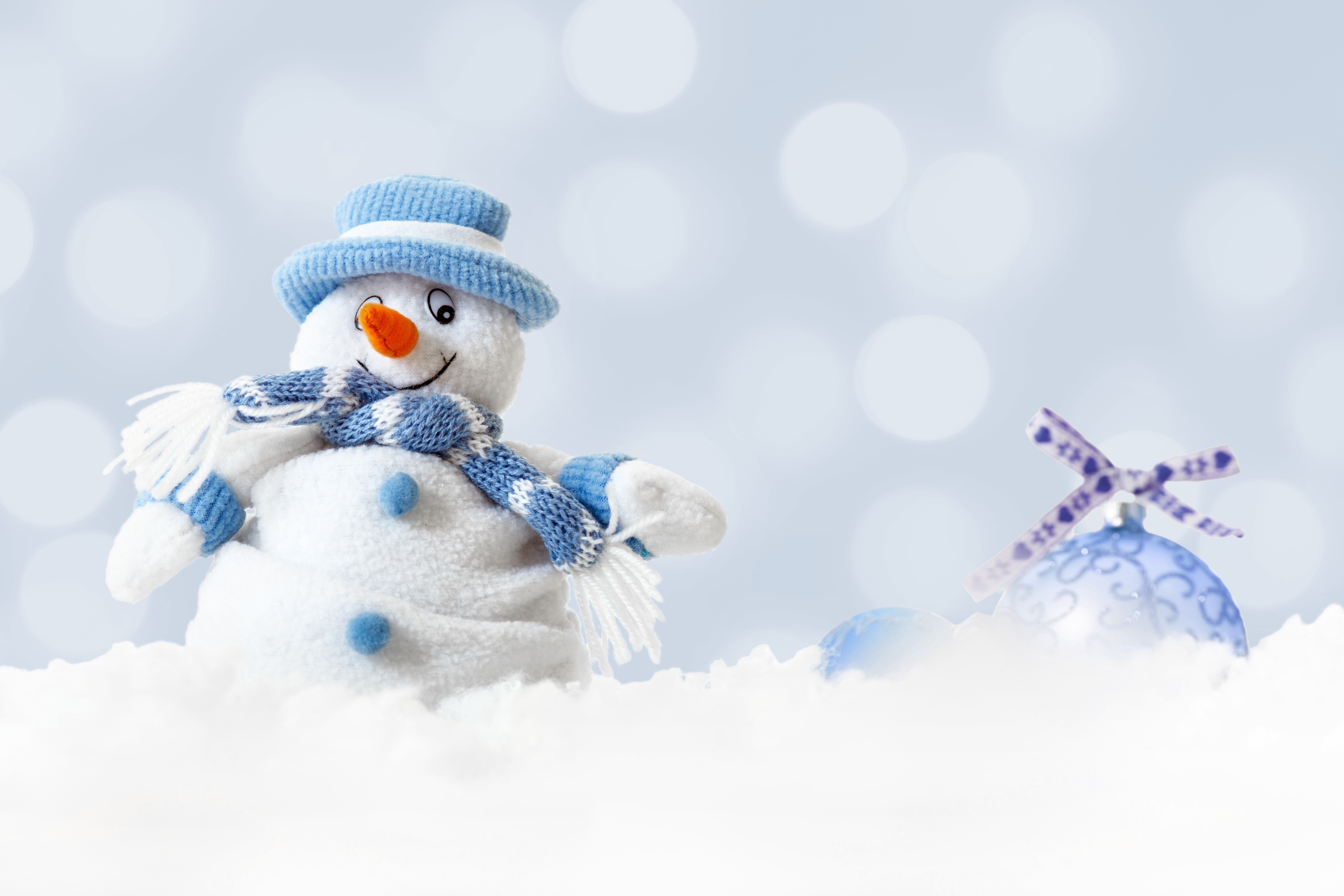 Snowman with blue hat and scarf in snow HD Wallpaper