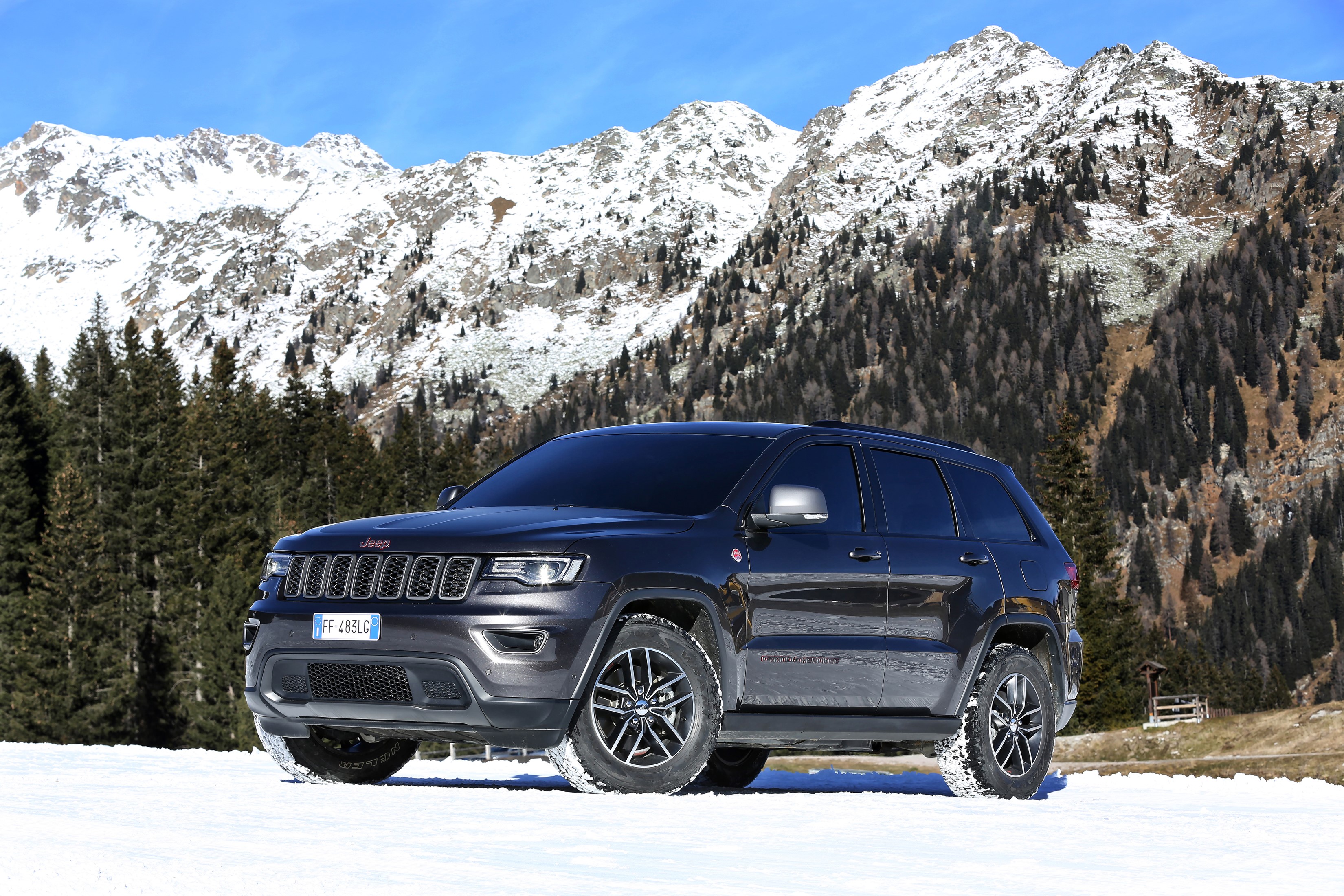 2016 Jeep Grand Cherokee Trailhawk in Snowy Mountains HD Wallpaper