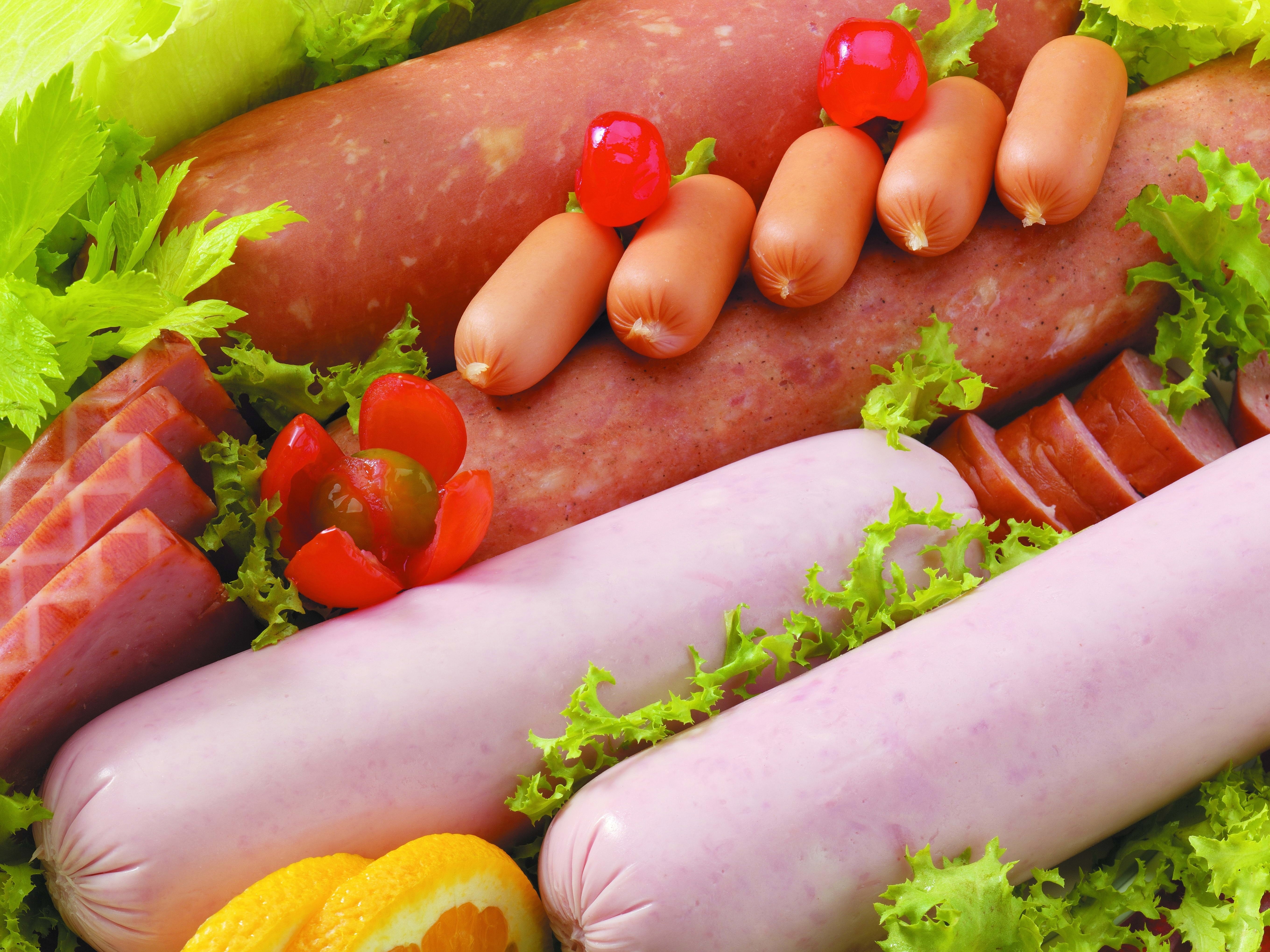 Meat products: sausages, Vienna sausages, and garnishes HD Wallpaper