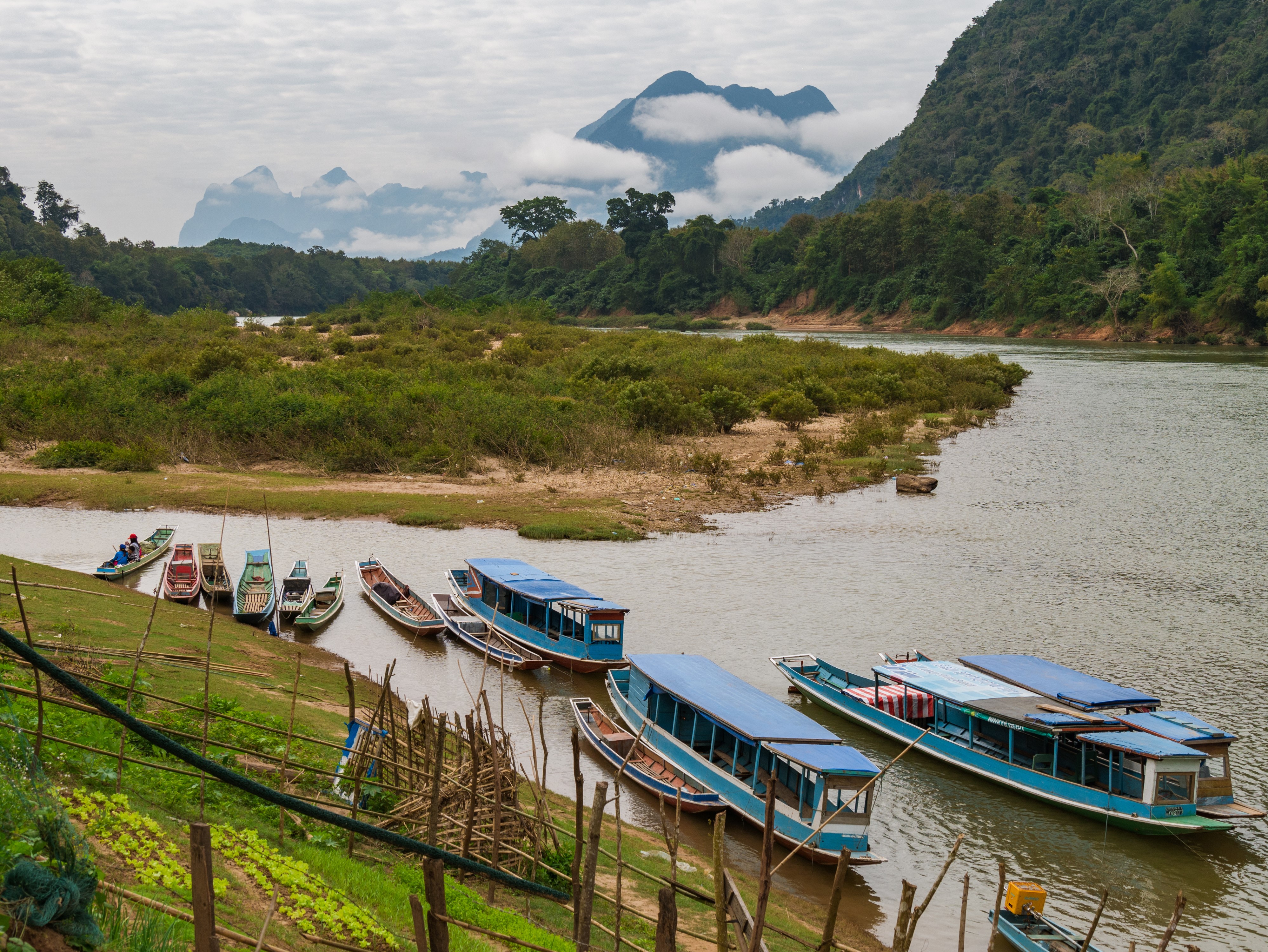 Boats on a river in Muang Ngoi, Laos HD Wallpaper