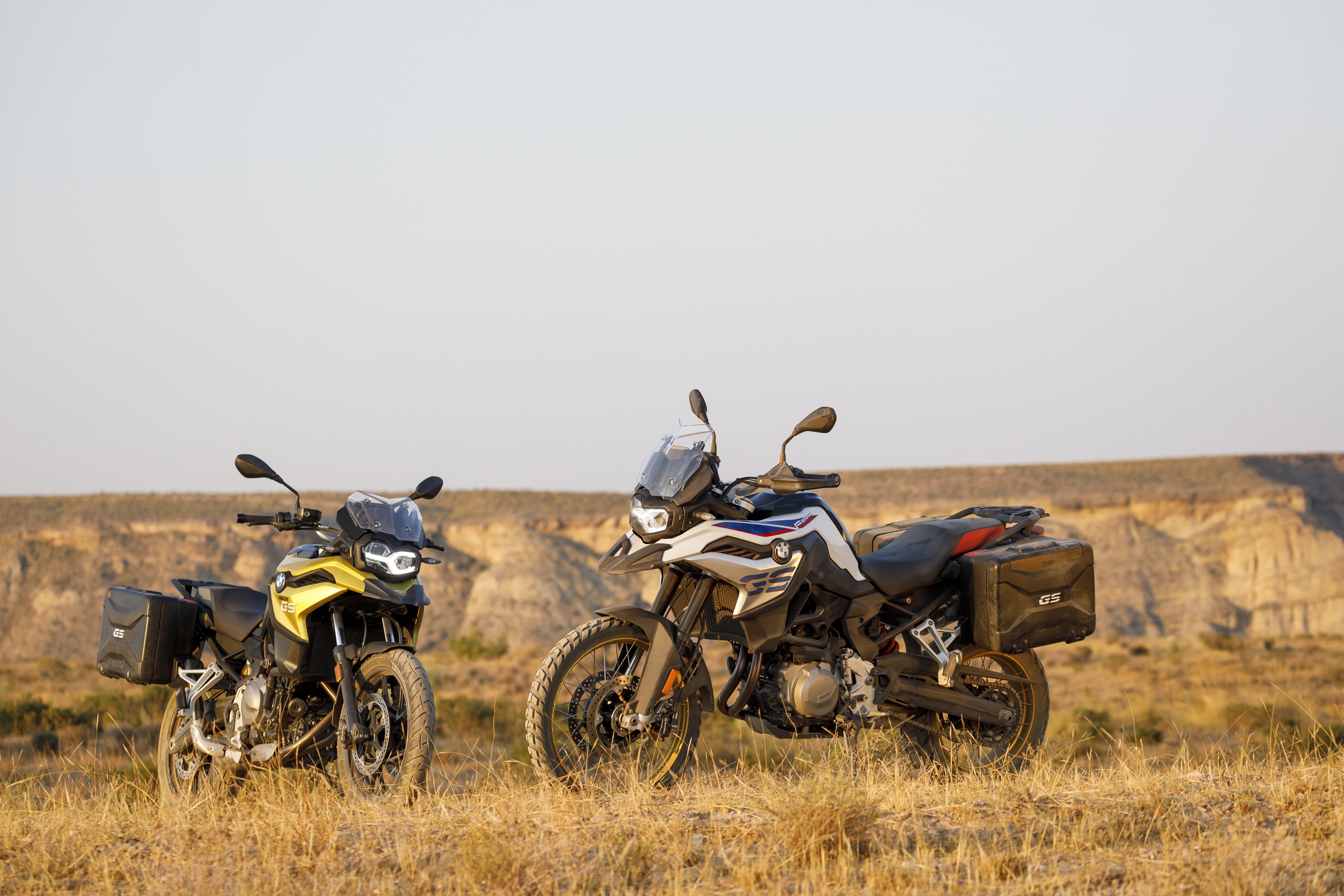 Two BMW F Series GS Motorcycles in a Field HD Wallpaper