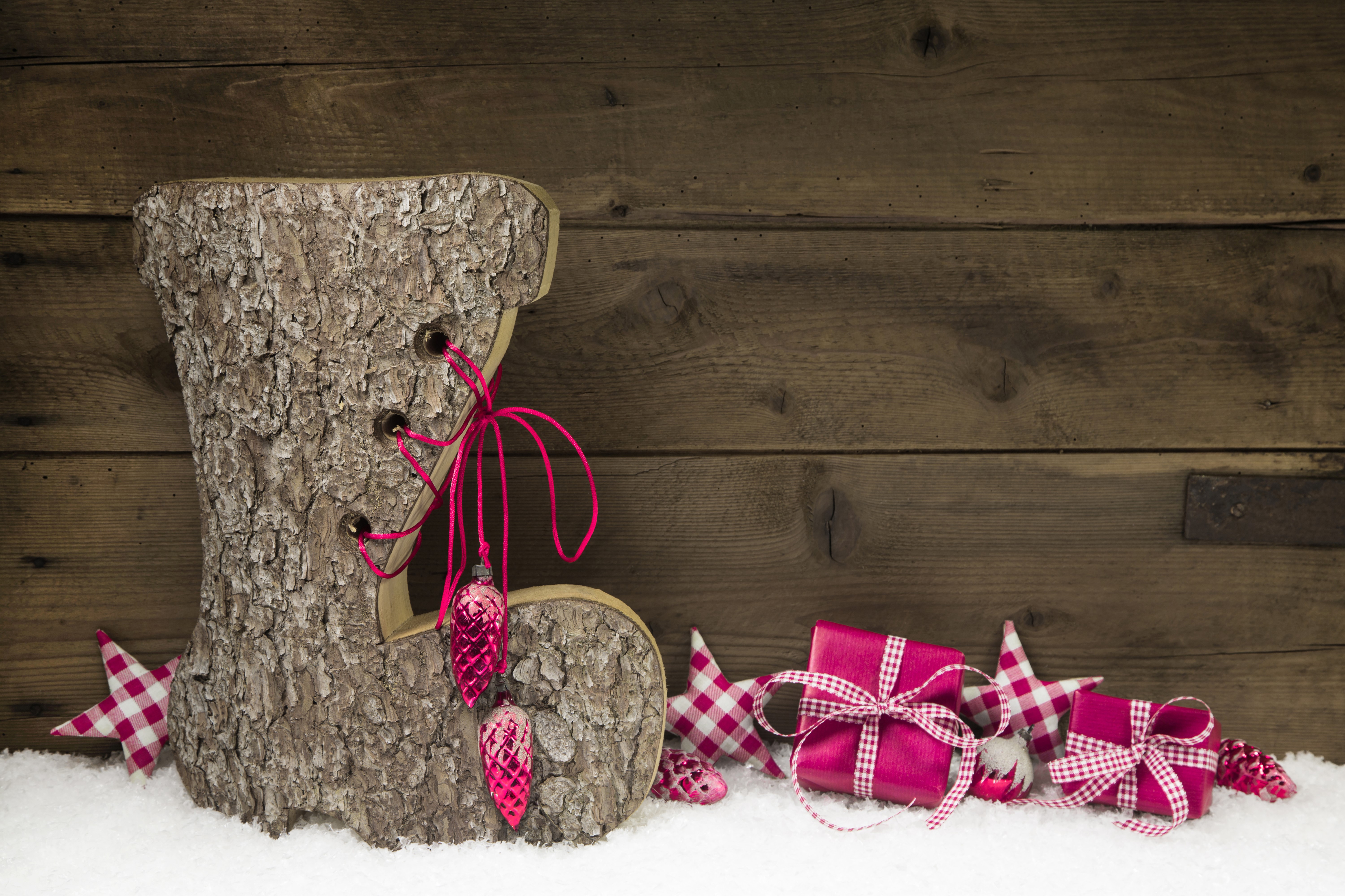 Christmas boot with gifts and ornaments on wood planks HD Wallpaper
