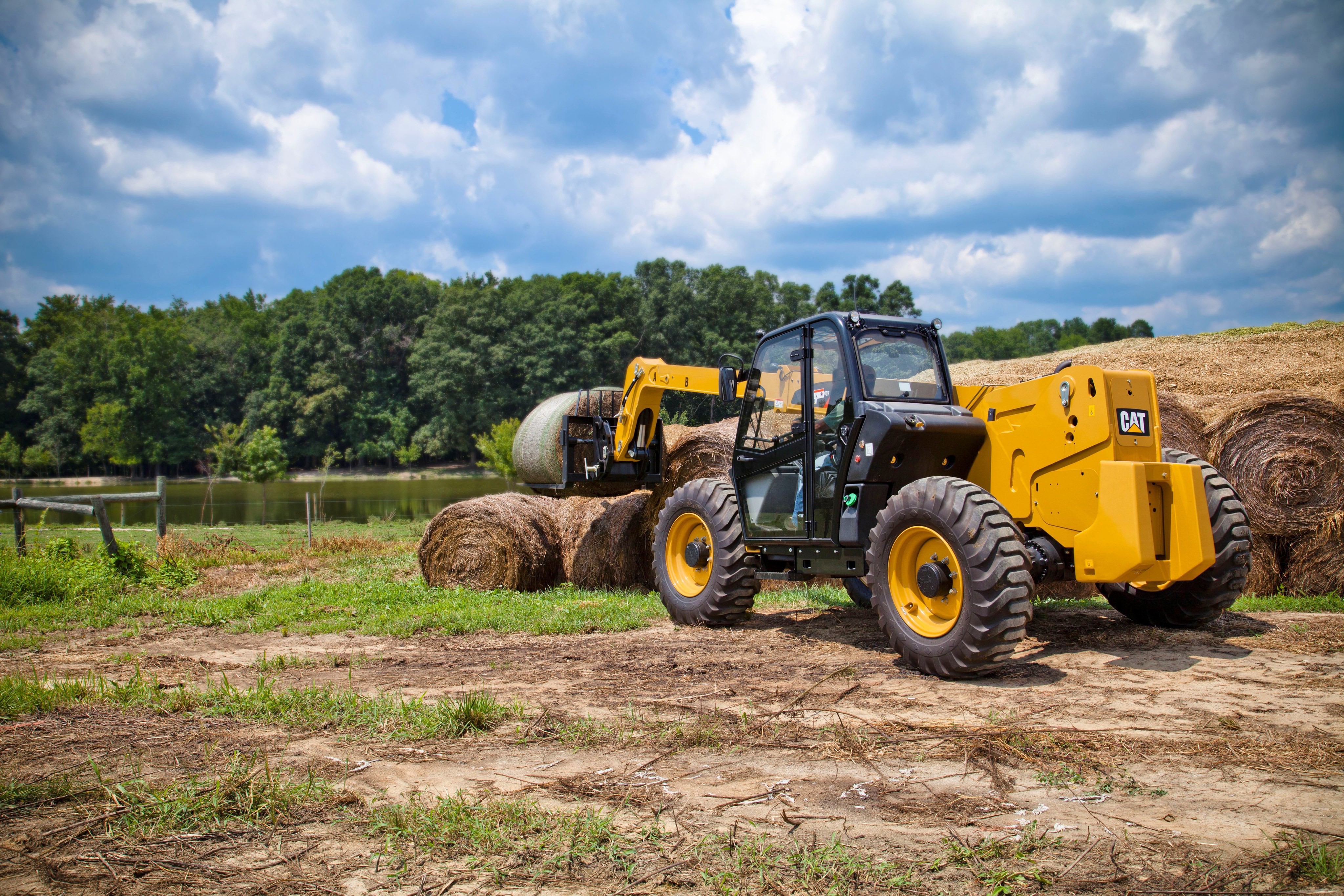 Caterpillar TH407 Telehandler with Hay Bales HD Wallpaper