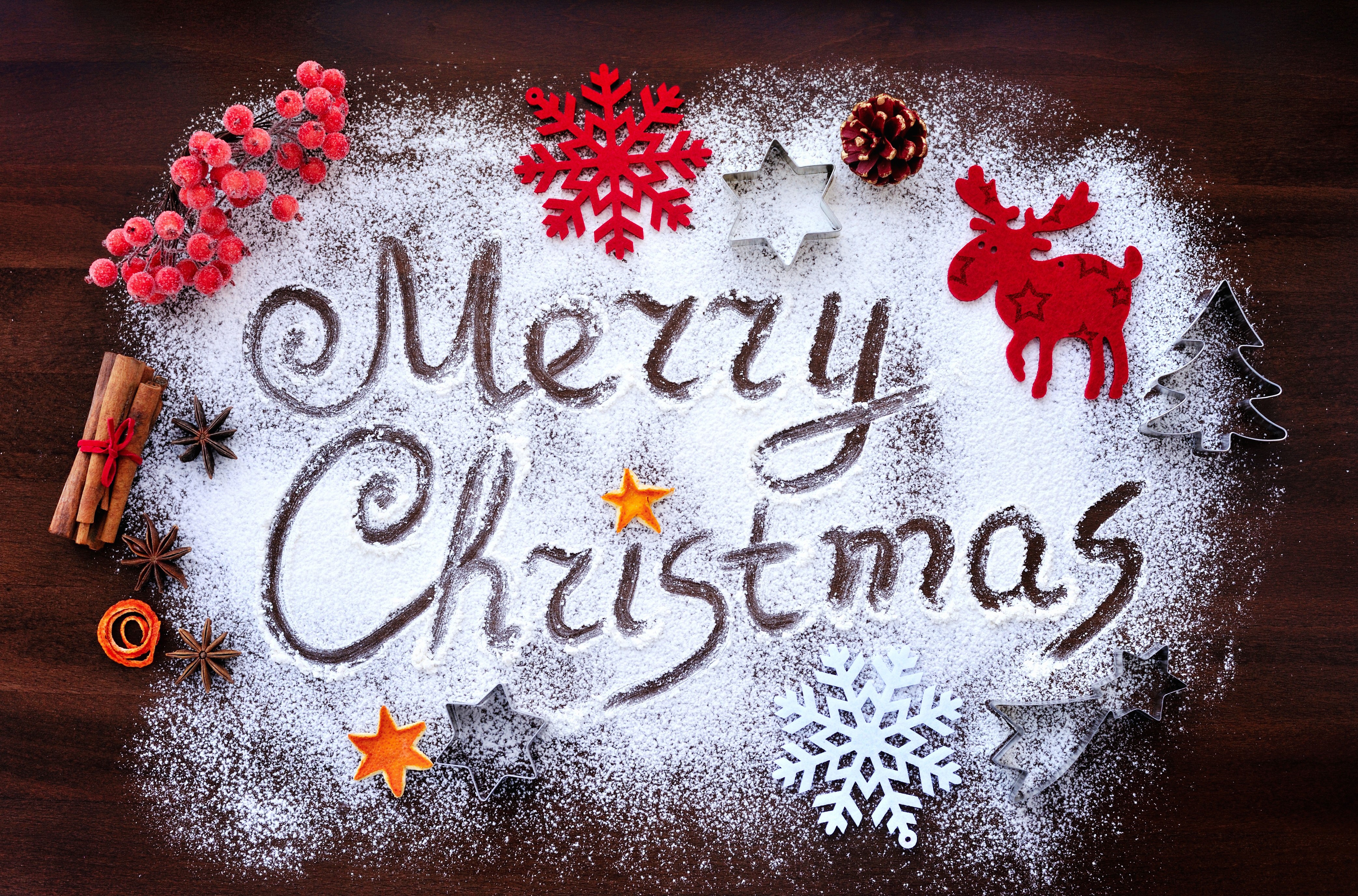 Merry Christmas written in powdered sugar with decorations HD Wallpaper