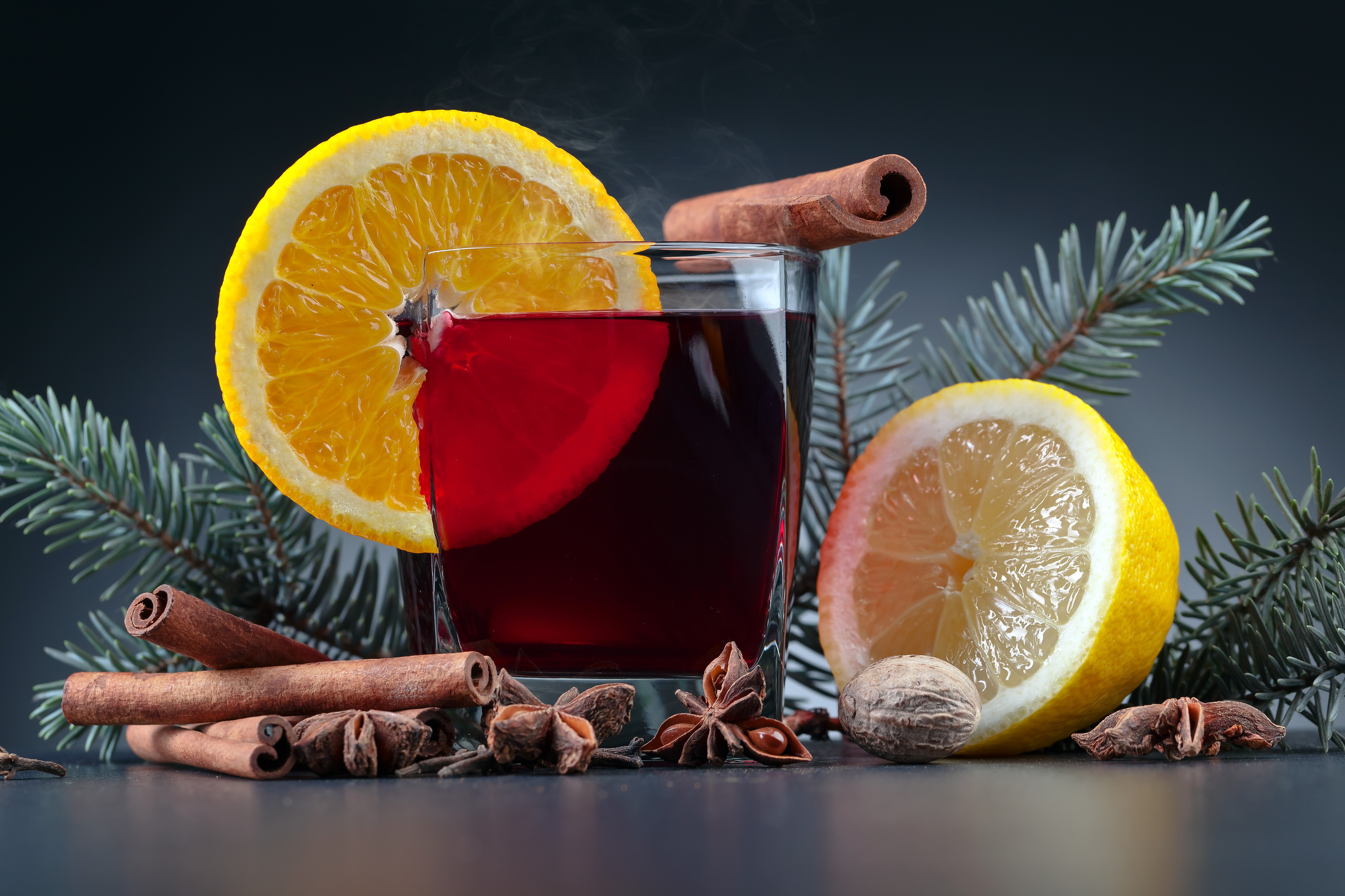 Mulled wine with orange, lemon, cinnamon, and star anise HD Wallpaper