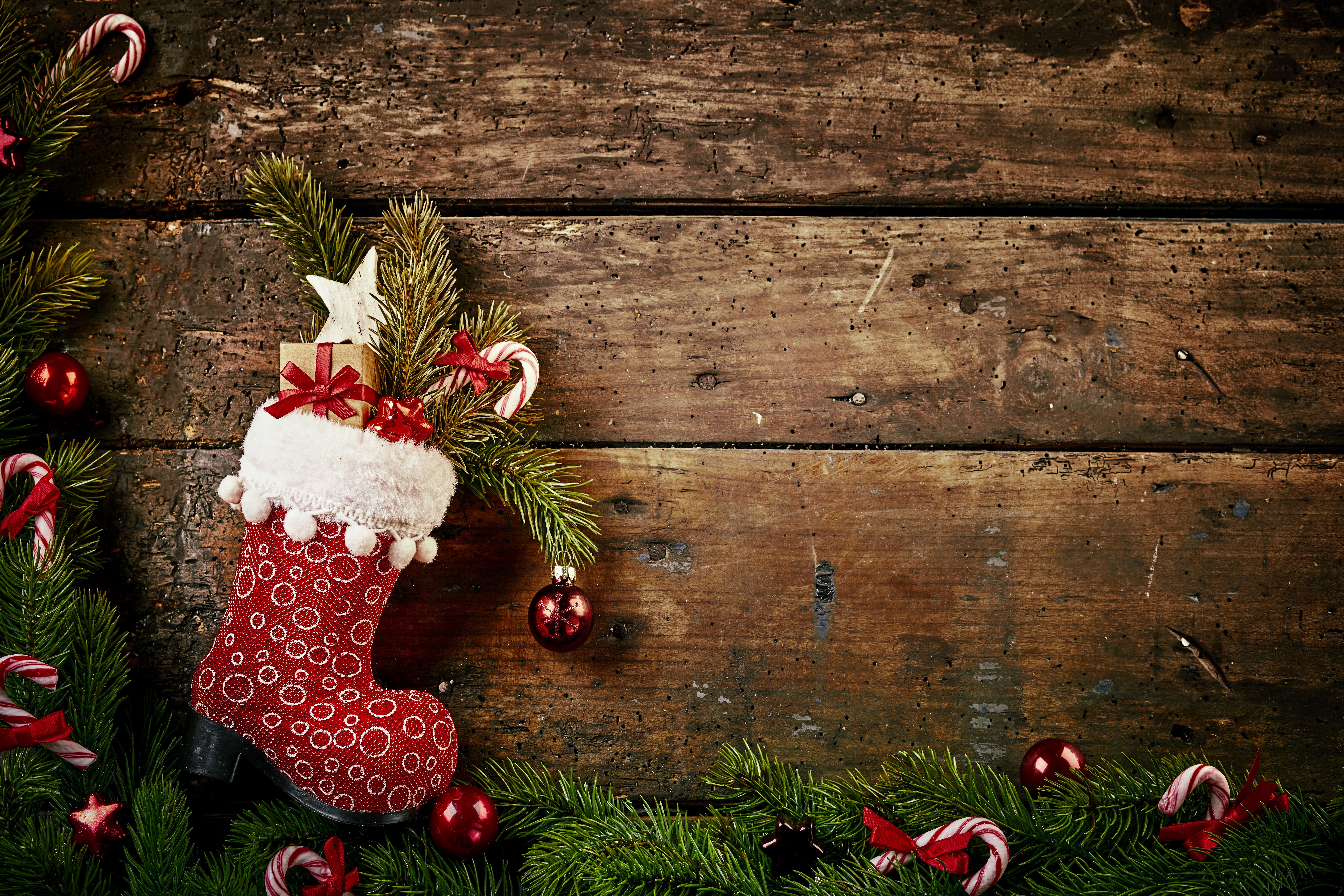 Christmas stocking with gifts on wood planks HD Wallpaper