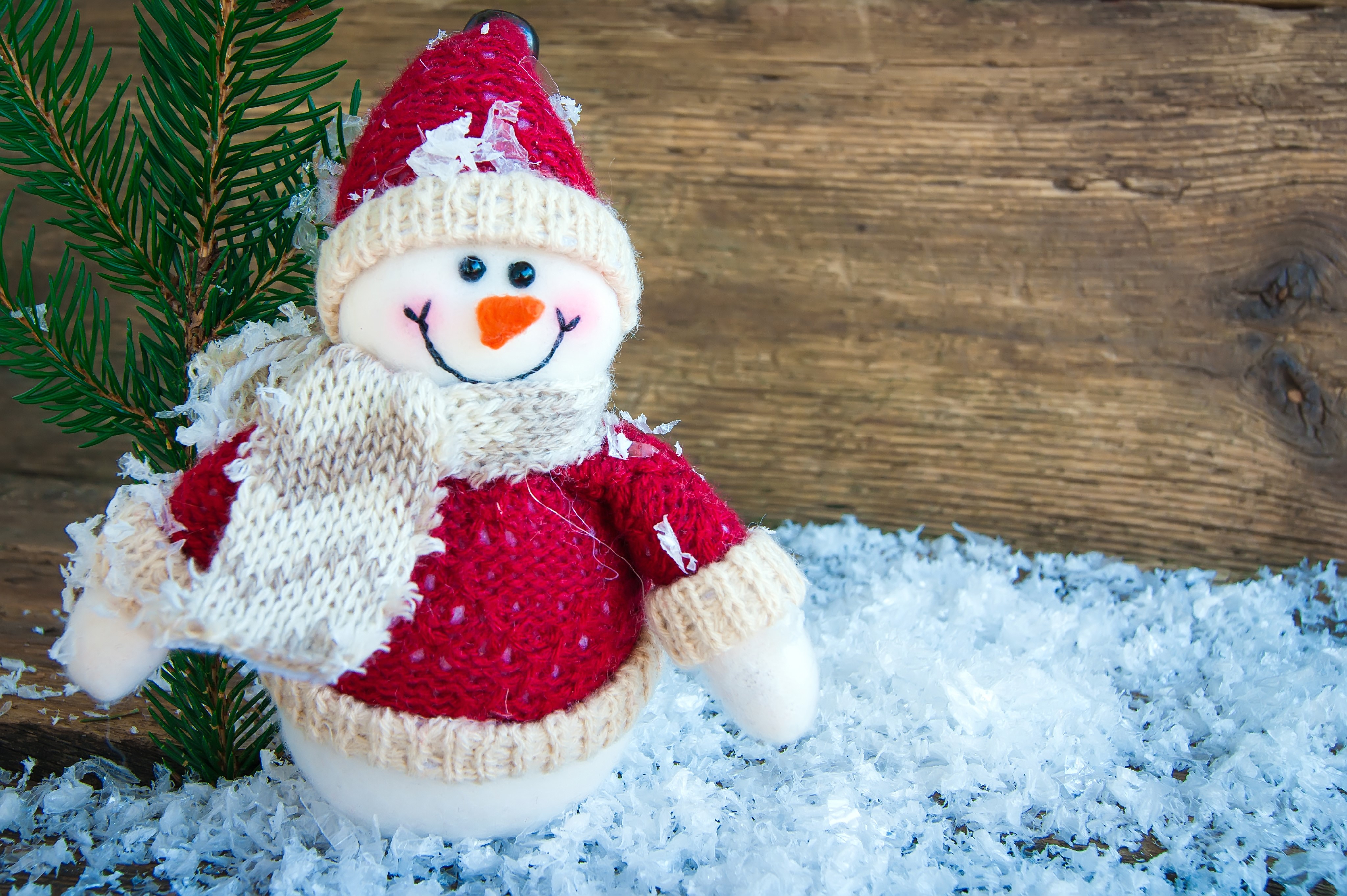 Snowman with red sweater and scarf in snow HD Wallpaper