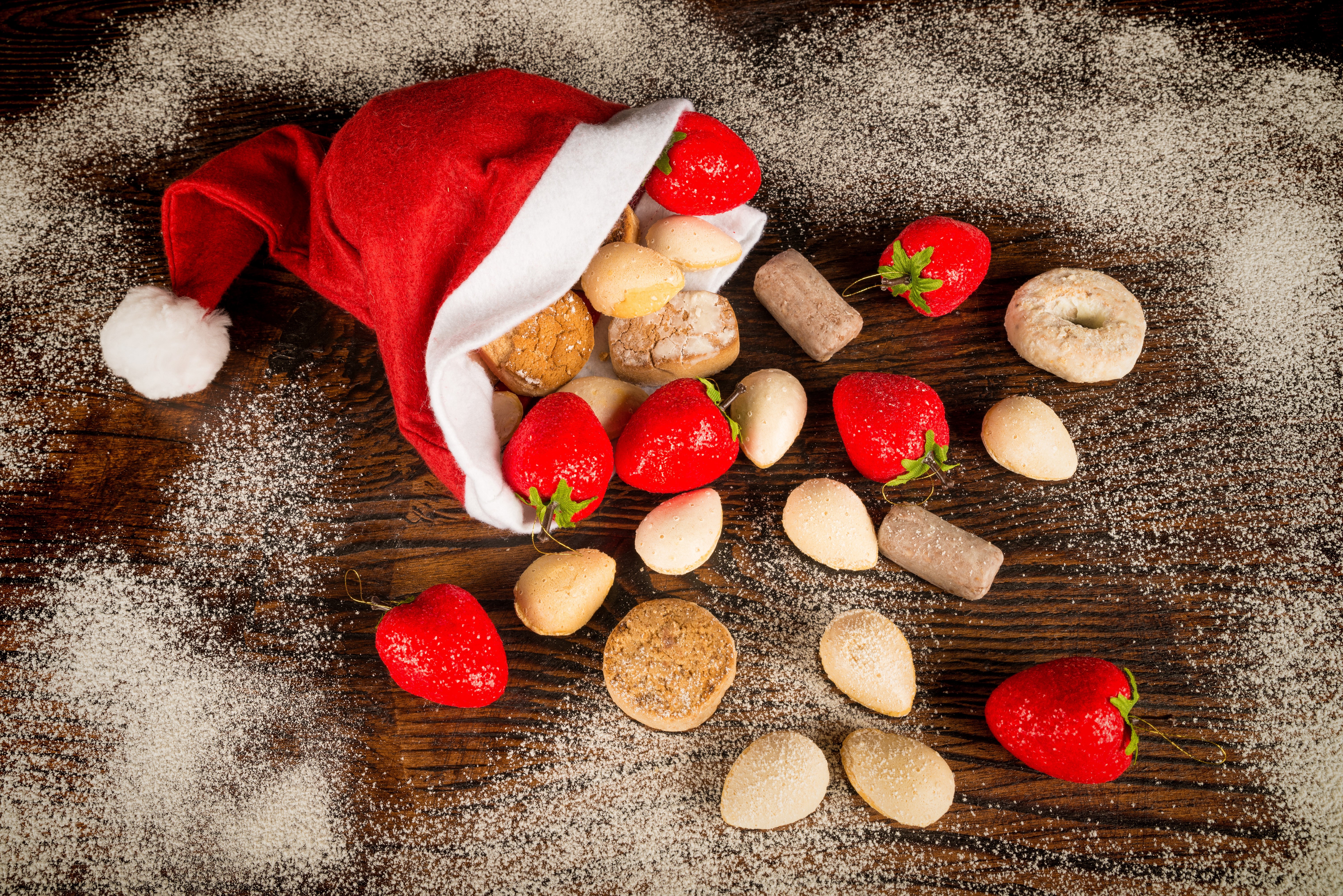 Christmas Santa hat with strawberries and cookies HD Wallpaper