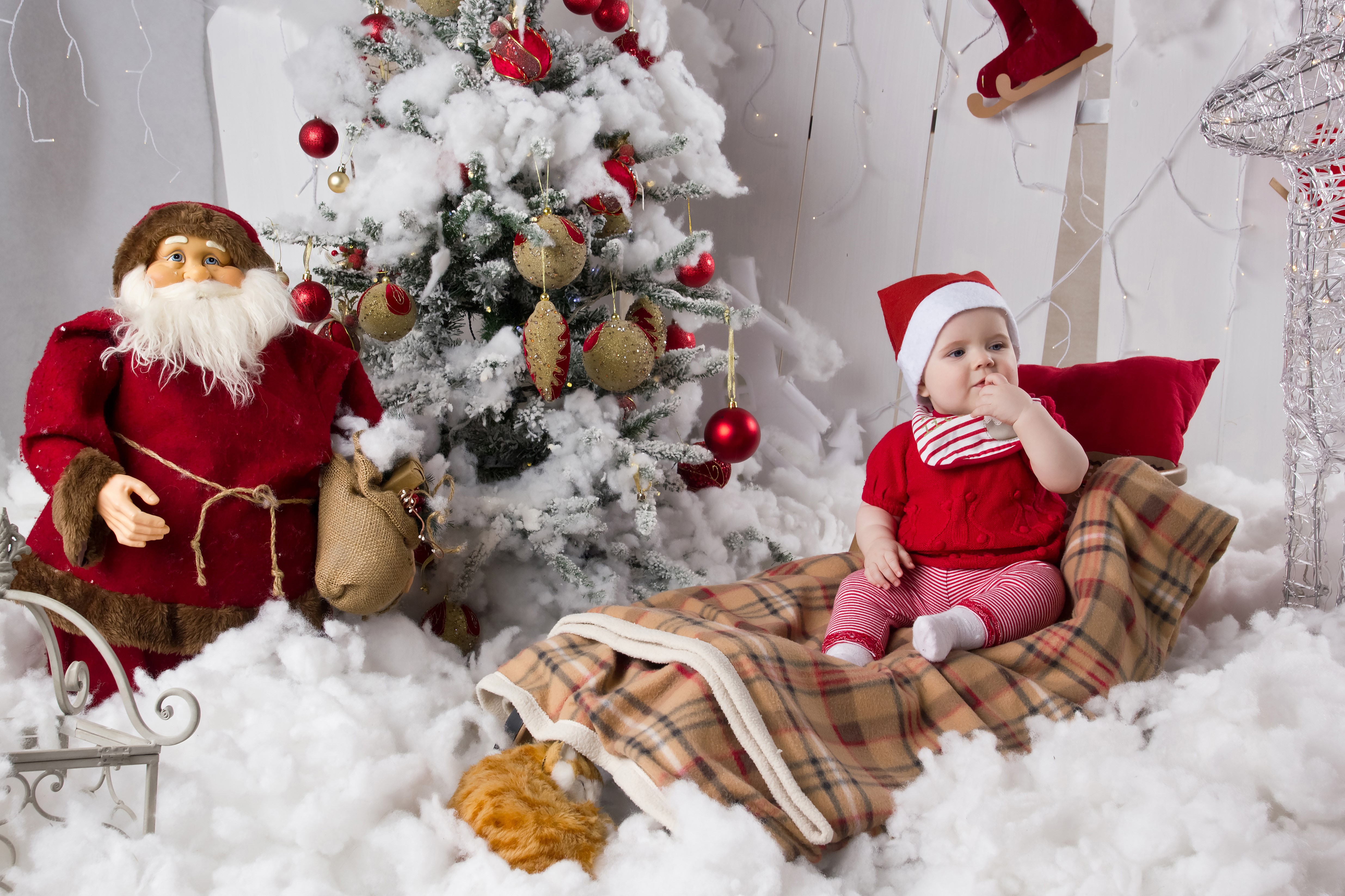 4K Christmas scene with baby, Santa Claus, and tree HD Wallpaper