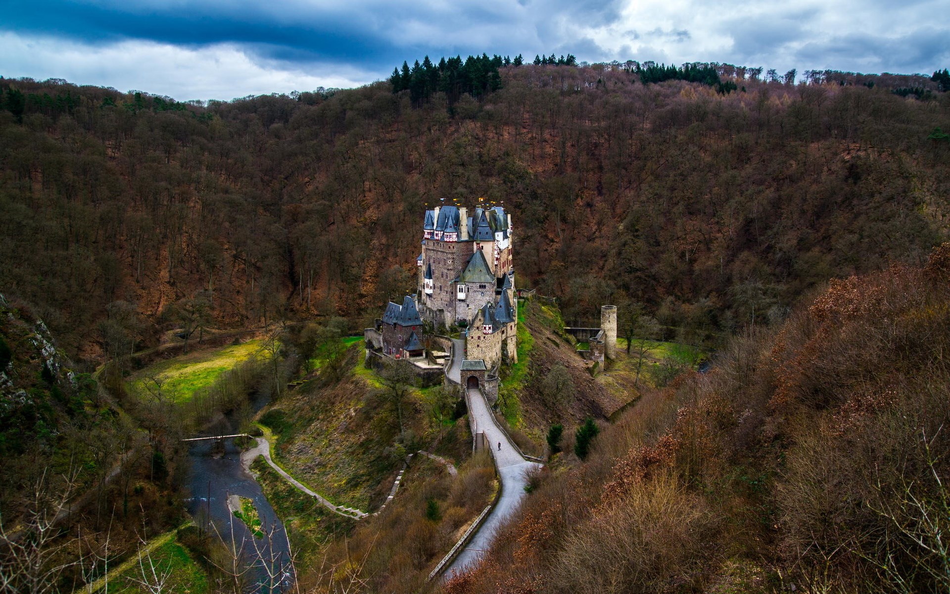 Eltz Castle in a forest valley with a river HD Wallpaper