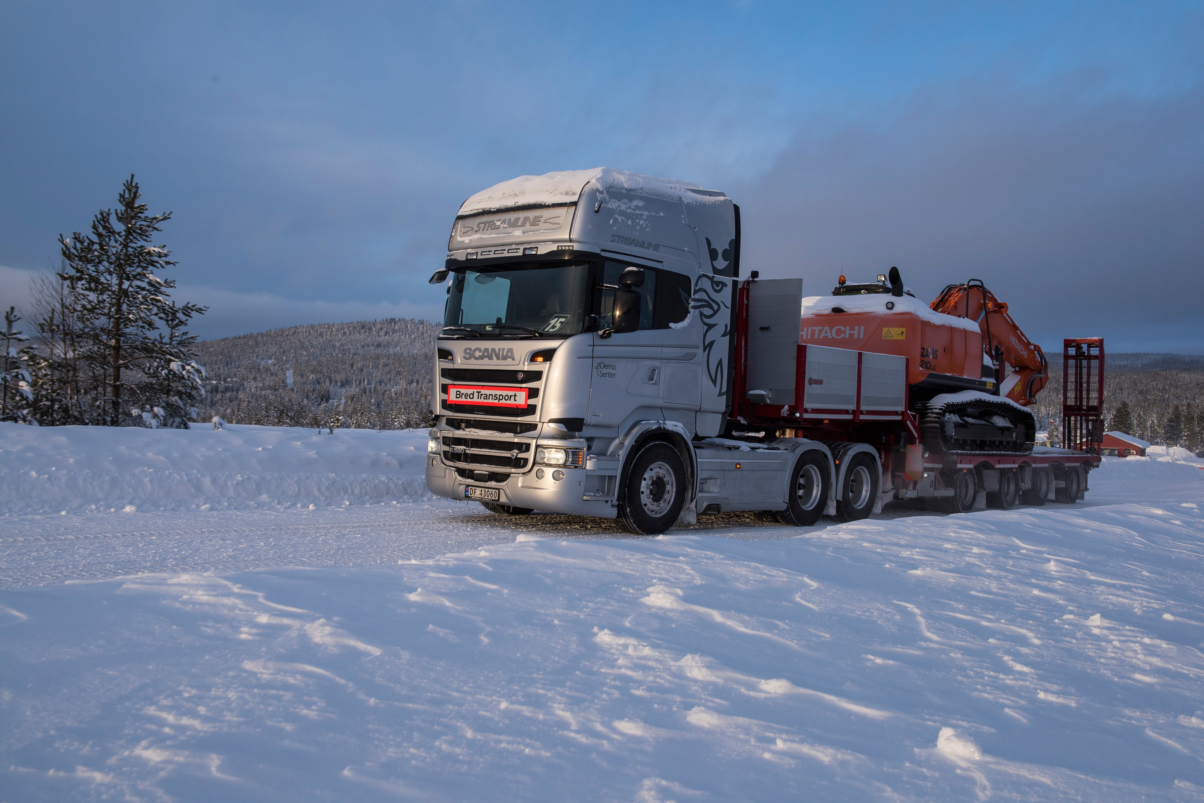 4K Scania Truck Transporting Excavator in Snow HD Wallpaper