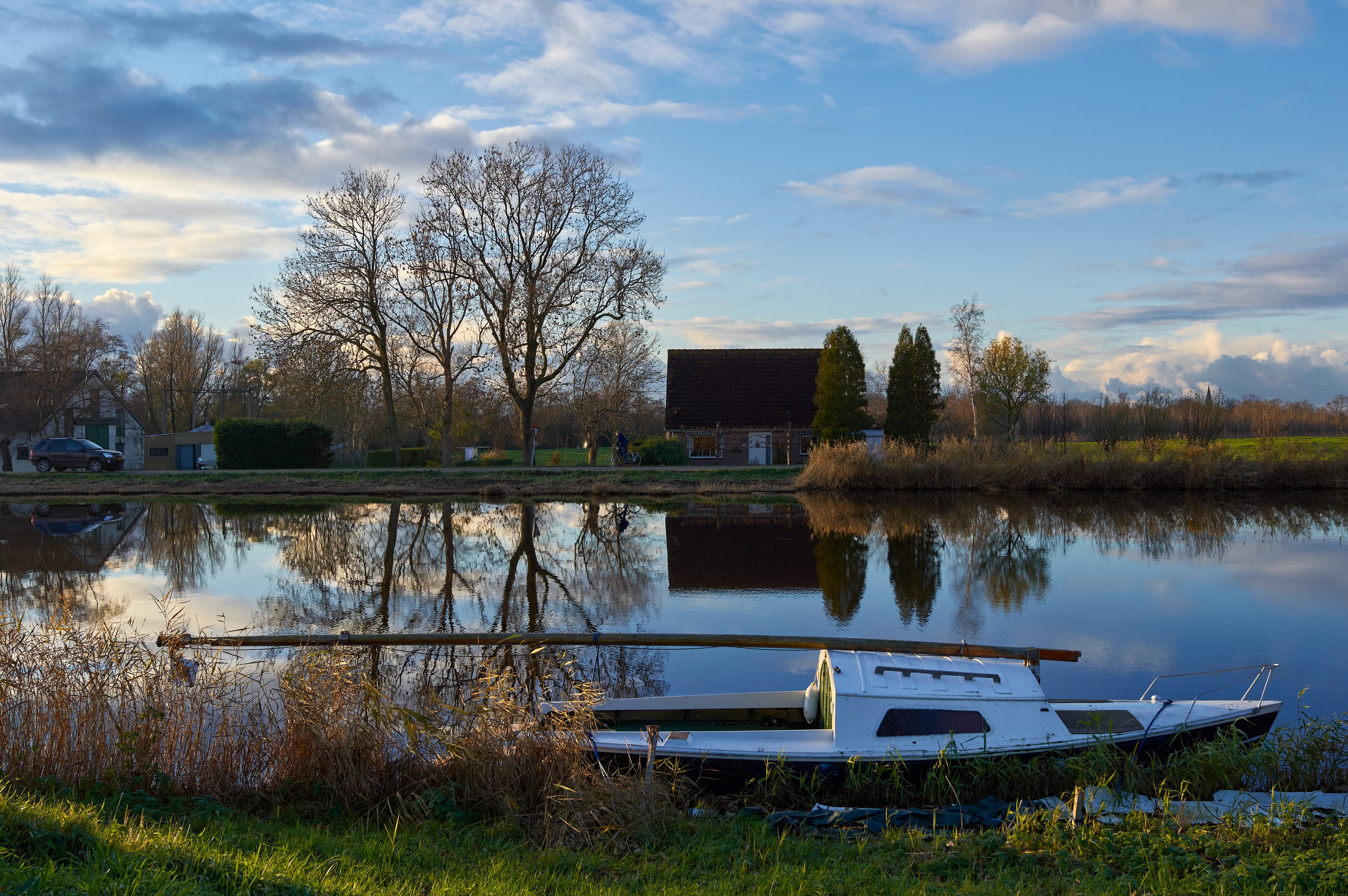 Motorboat on a canal in Assendelft, Netherlands HD Wallpaper