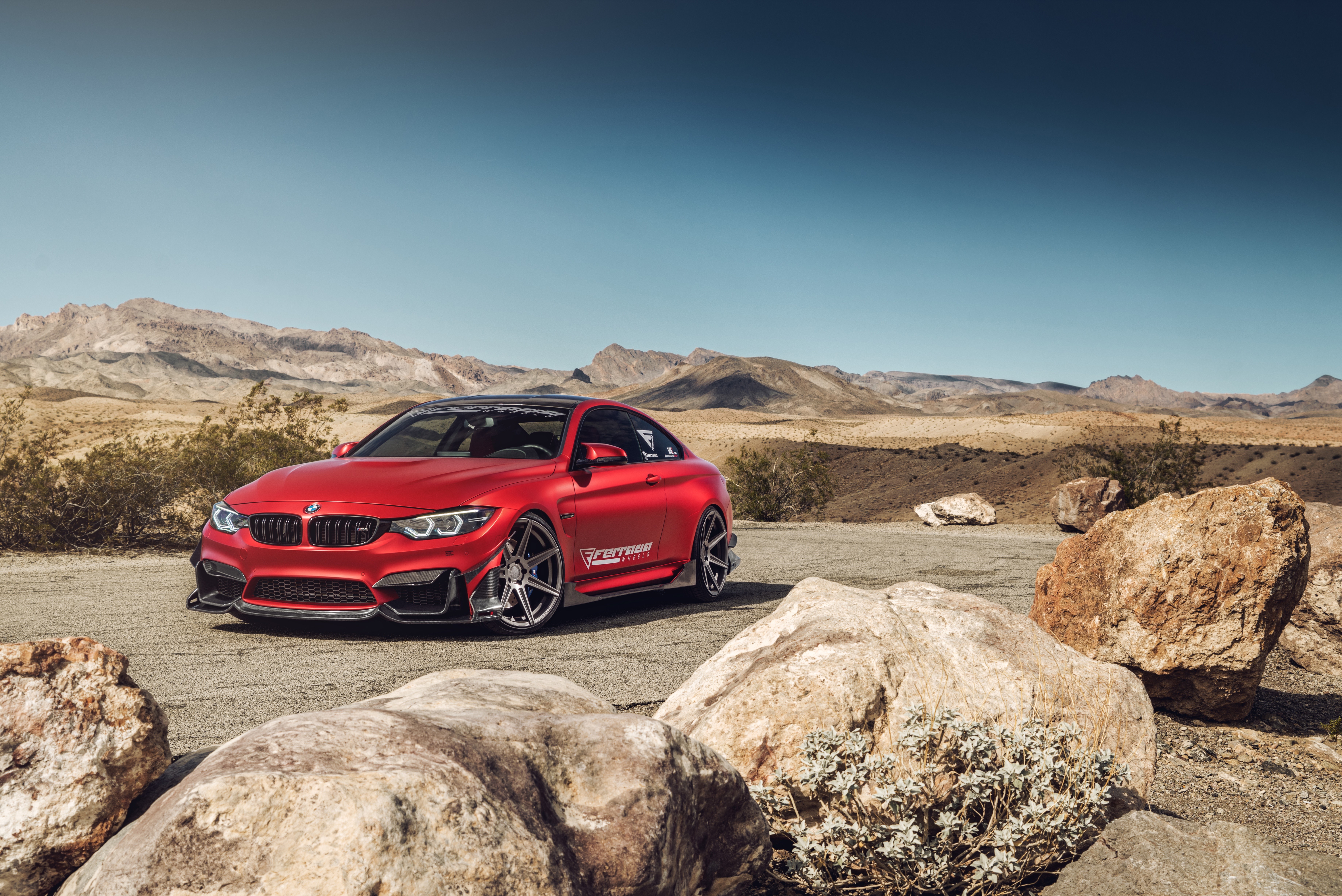 Red BMW M4 in a desert landscape HD Wallpaper