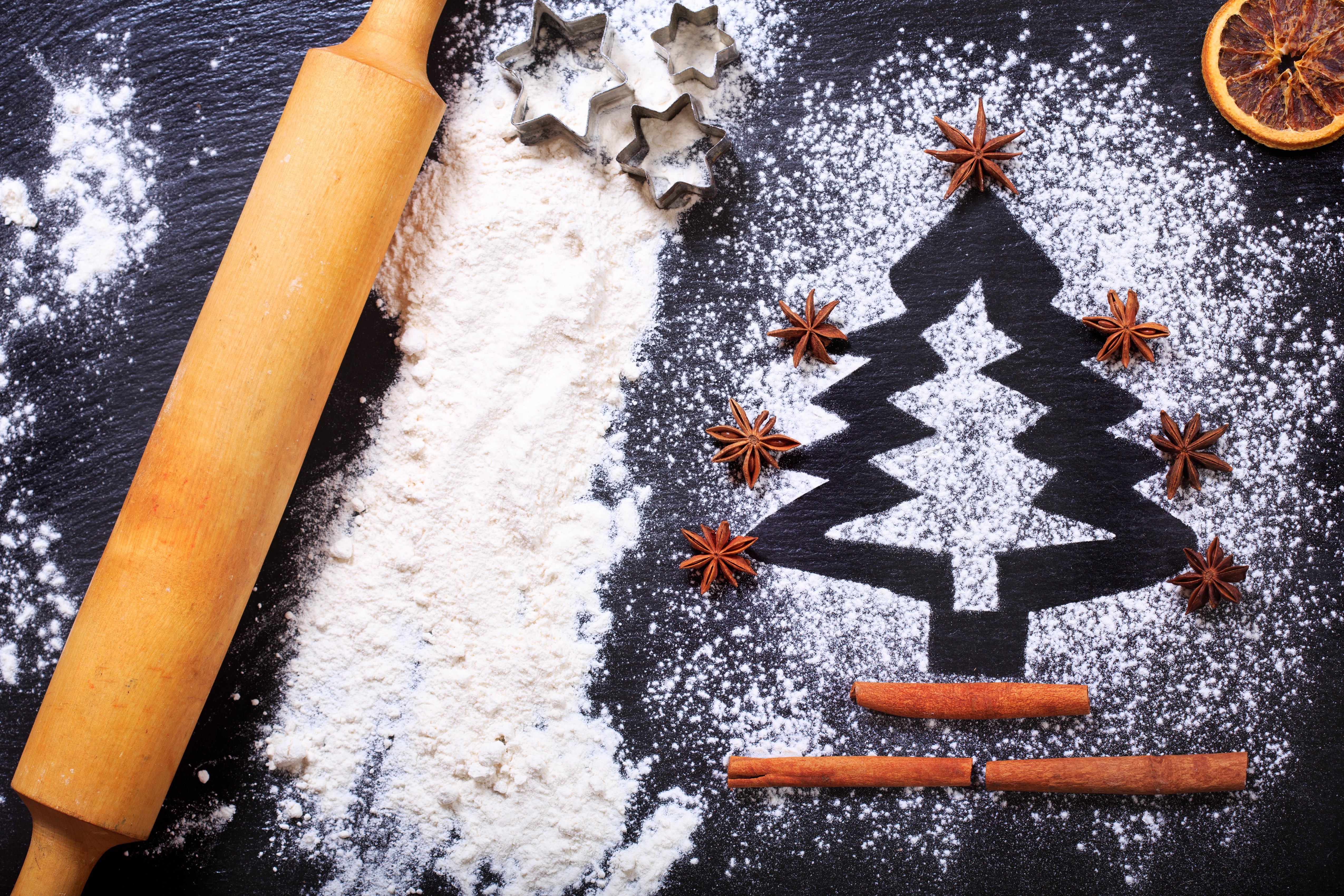 Christmas baking ingredients with rolling pin and cookie cutters HD Wallpaper