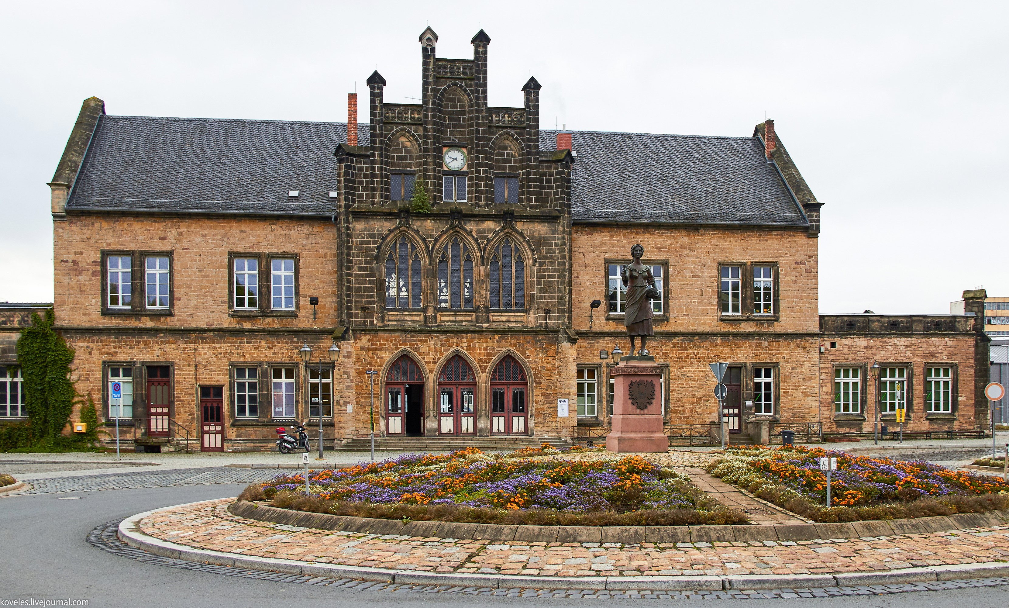 Train station building with a statue in Quedlinburg, Germany HD Wallpaper