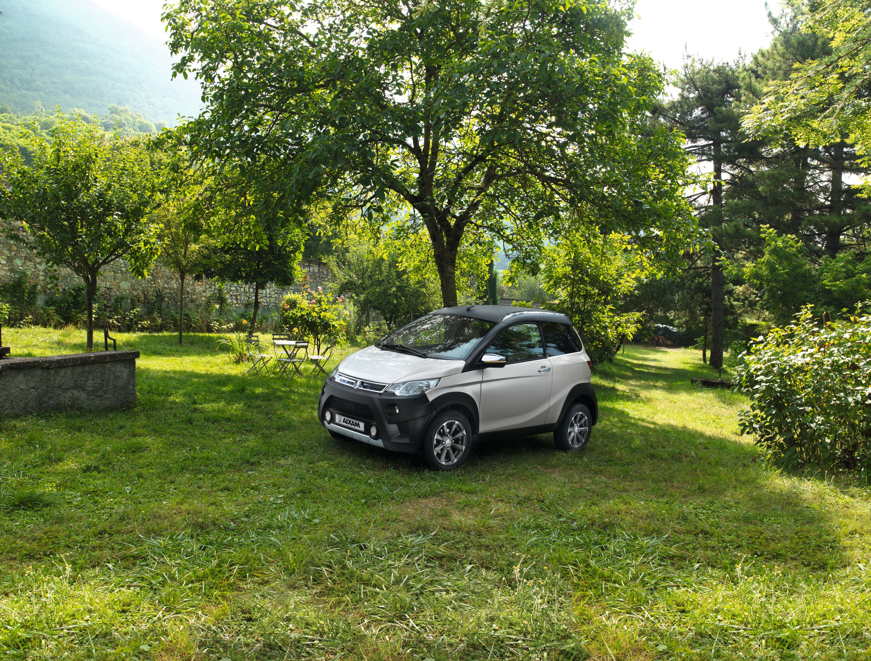 Silver 2016-17 Aixam Crossline Premium car in a garden HD Wallpaper