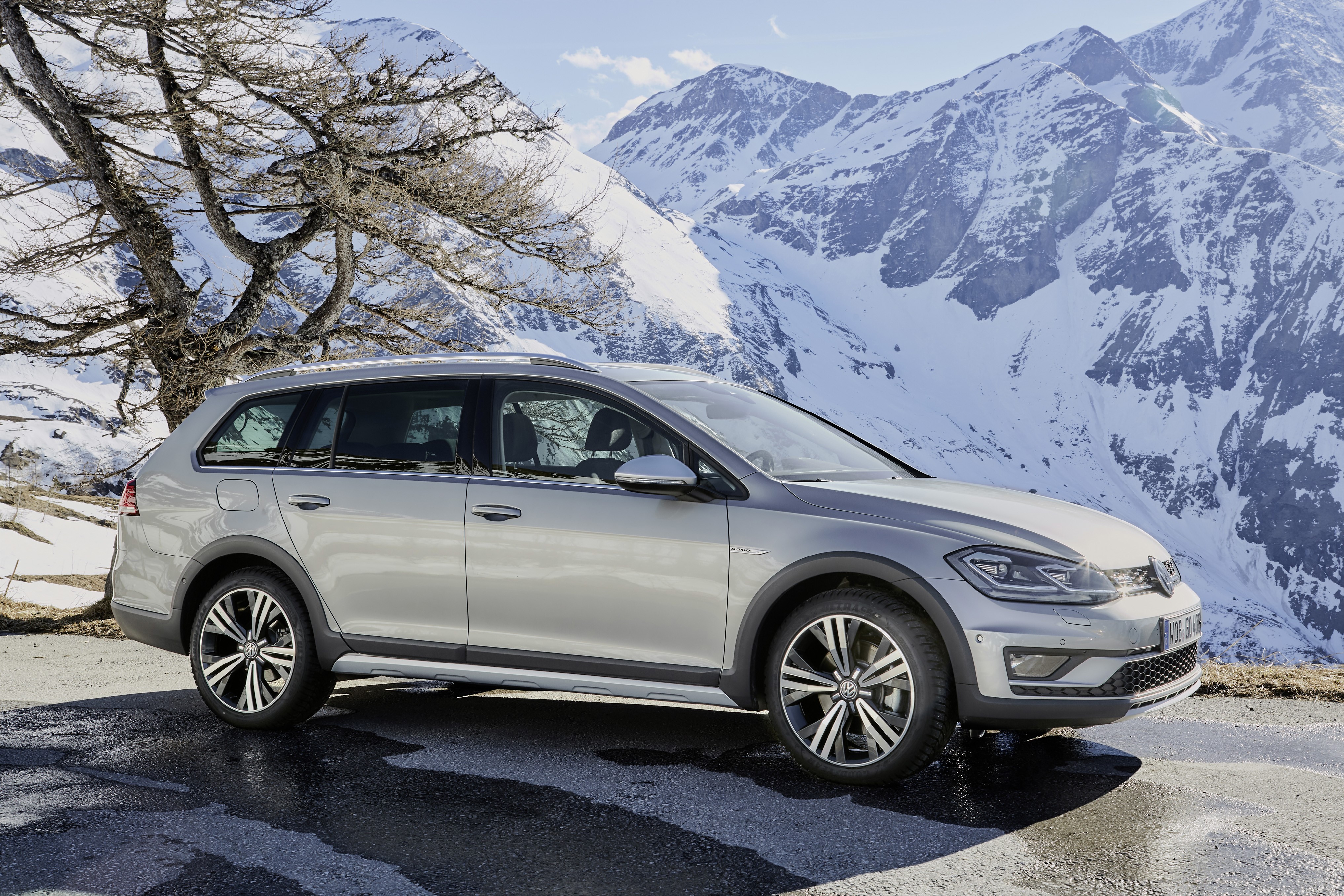 Volkswagen Golf Alltrack in snowy mountains HD Wallpaper