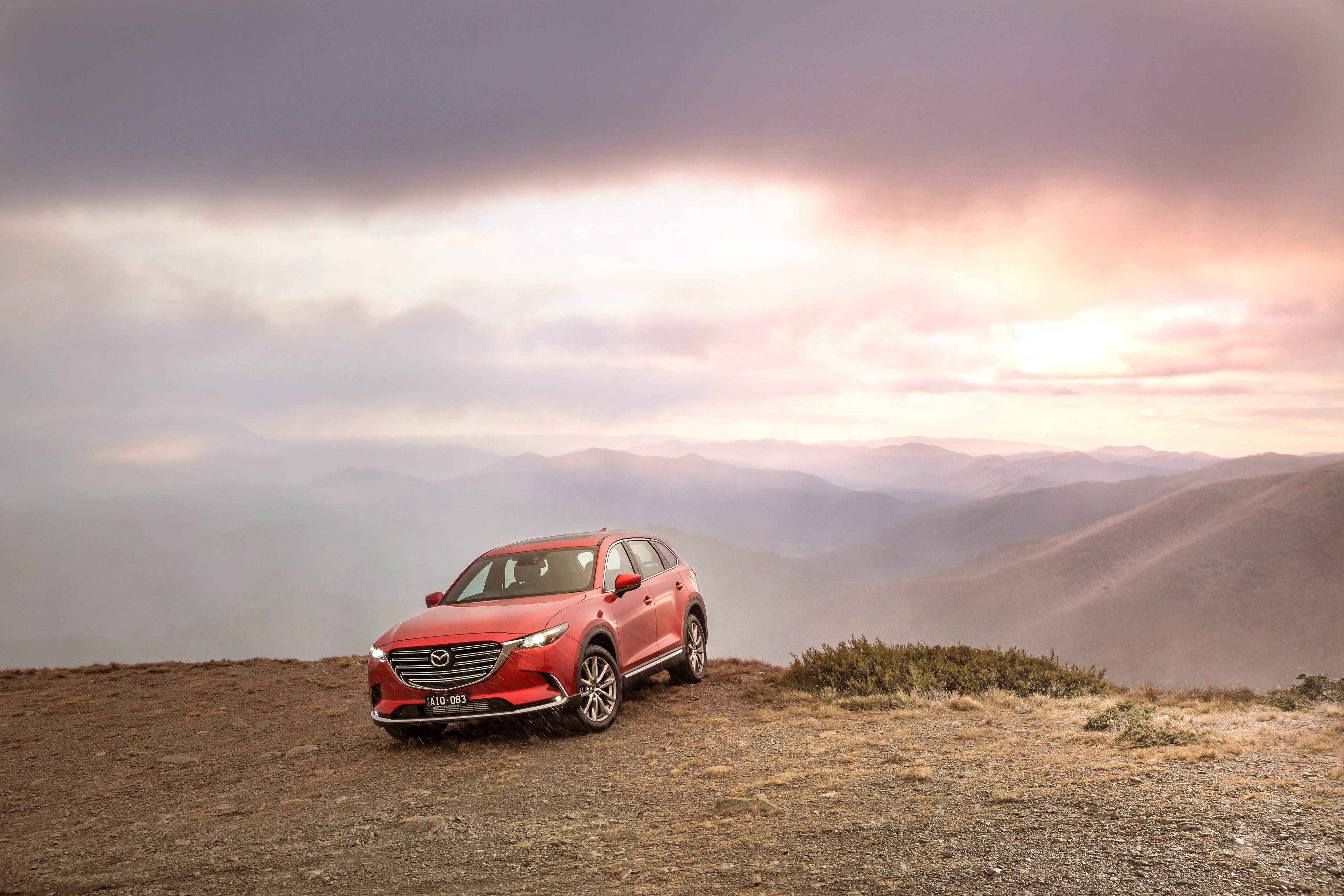 Red 2016 Mazda CX-9 GT on a mountain overlook HD Wallpaper