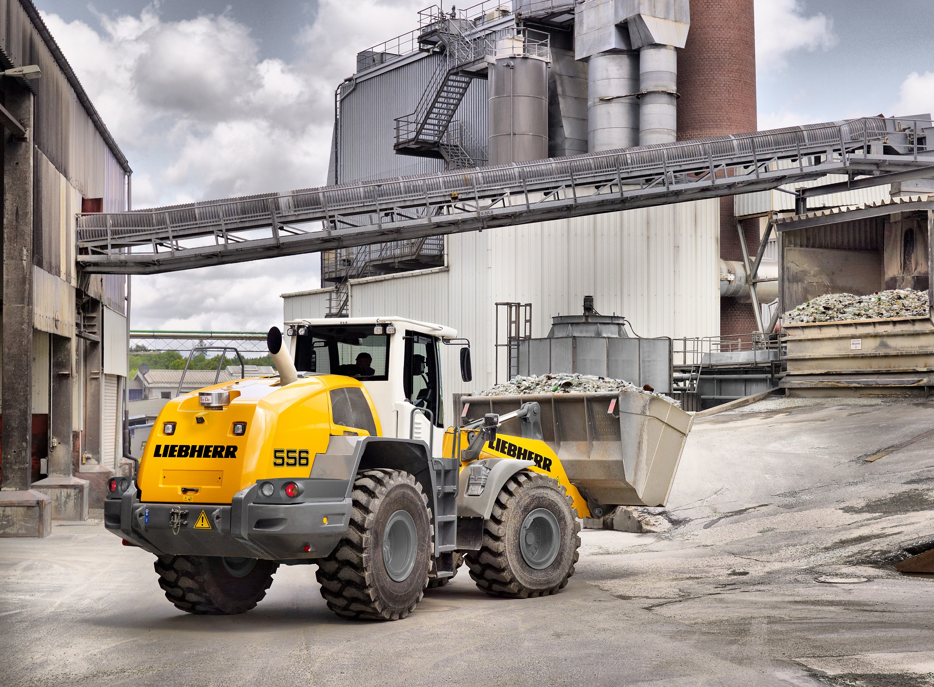 Liebherr L 556 wheel loader at industrial facility HD Wallpaper