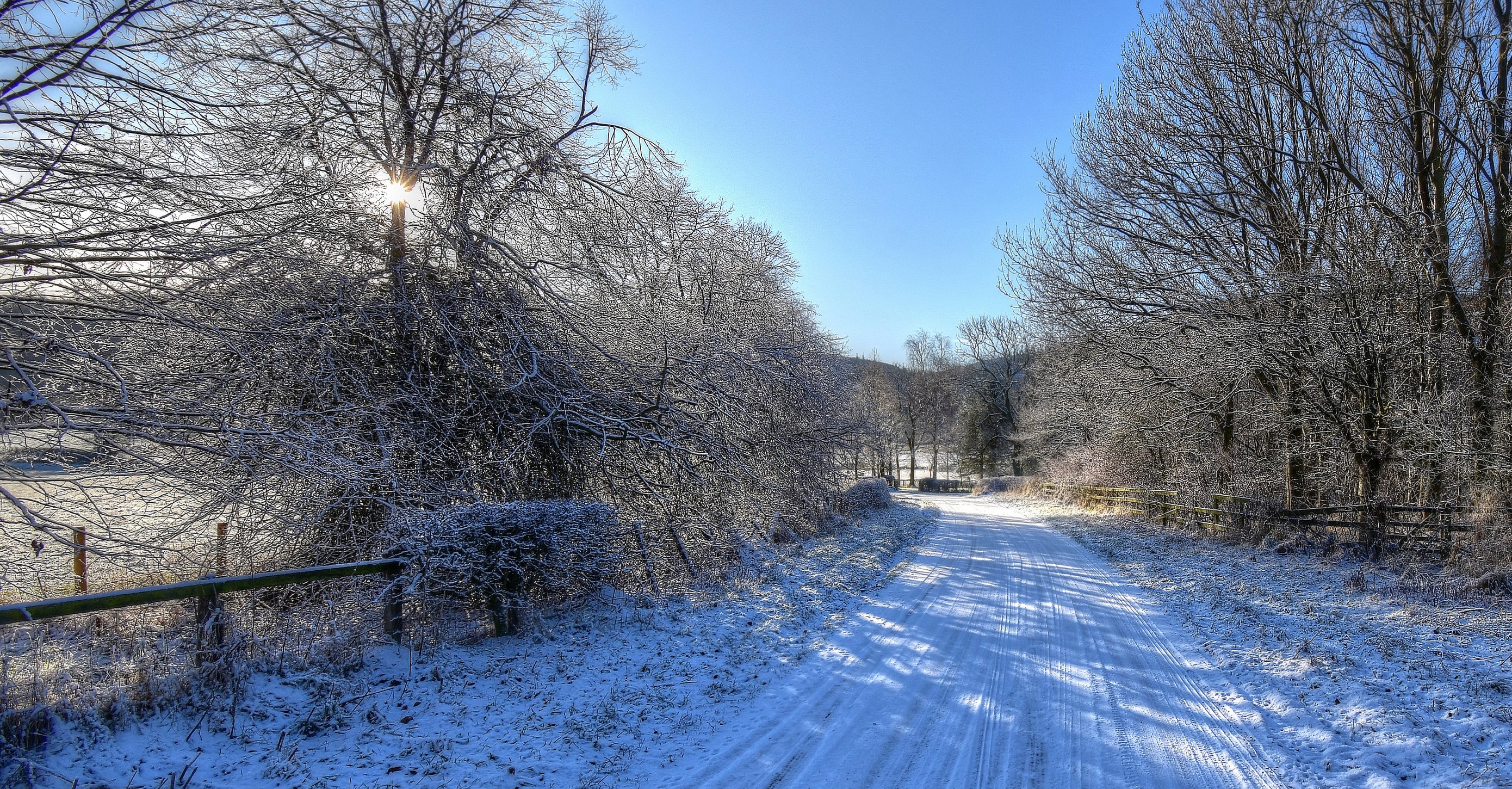 Snowy road in Yorkshire, England during winter HD Wallpaper