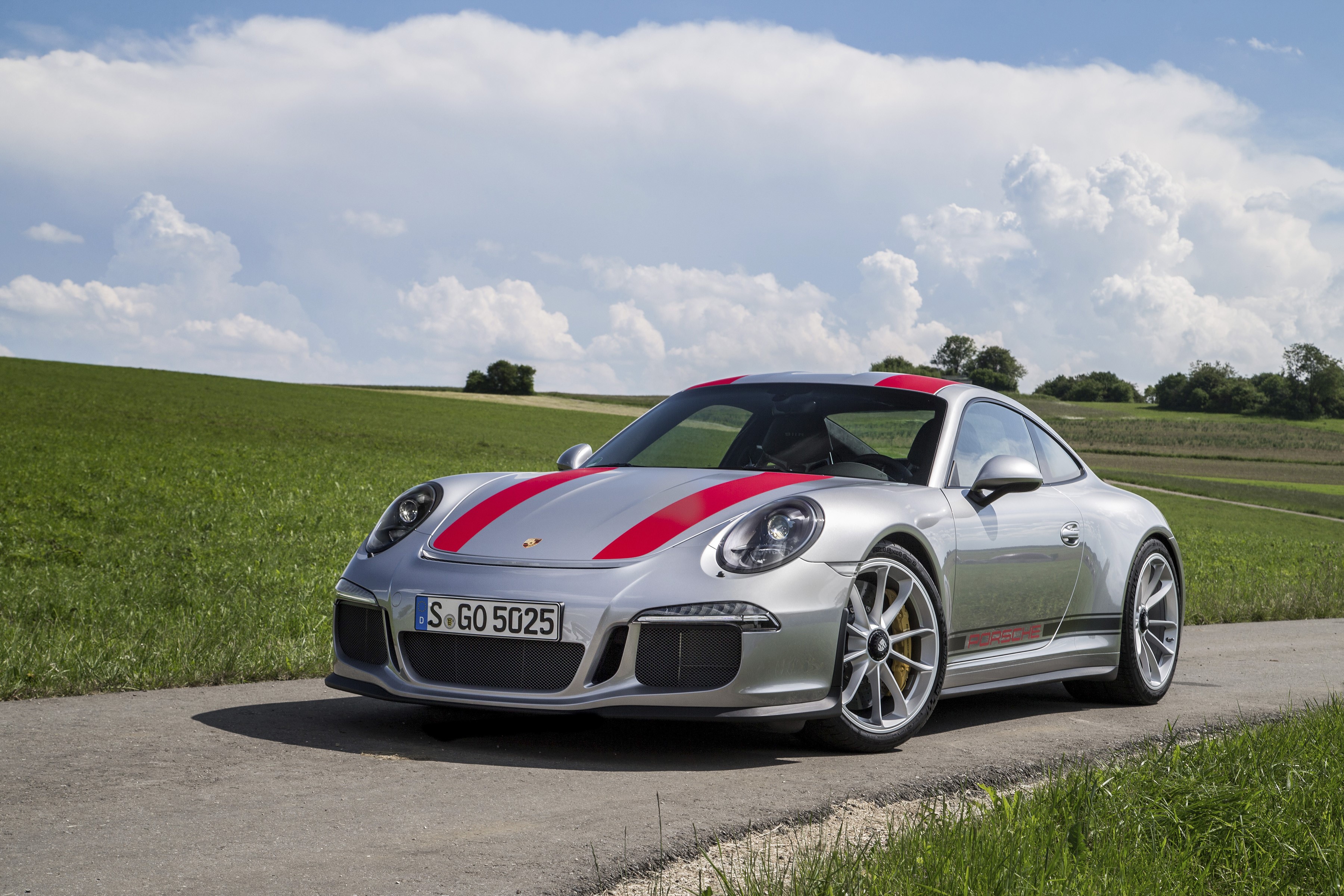Porsche 911 R on a road with green fields HD Wallpaper