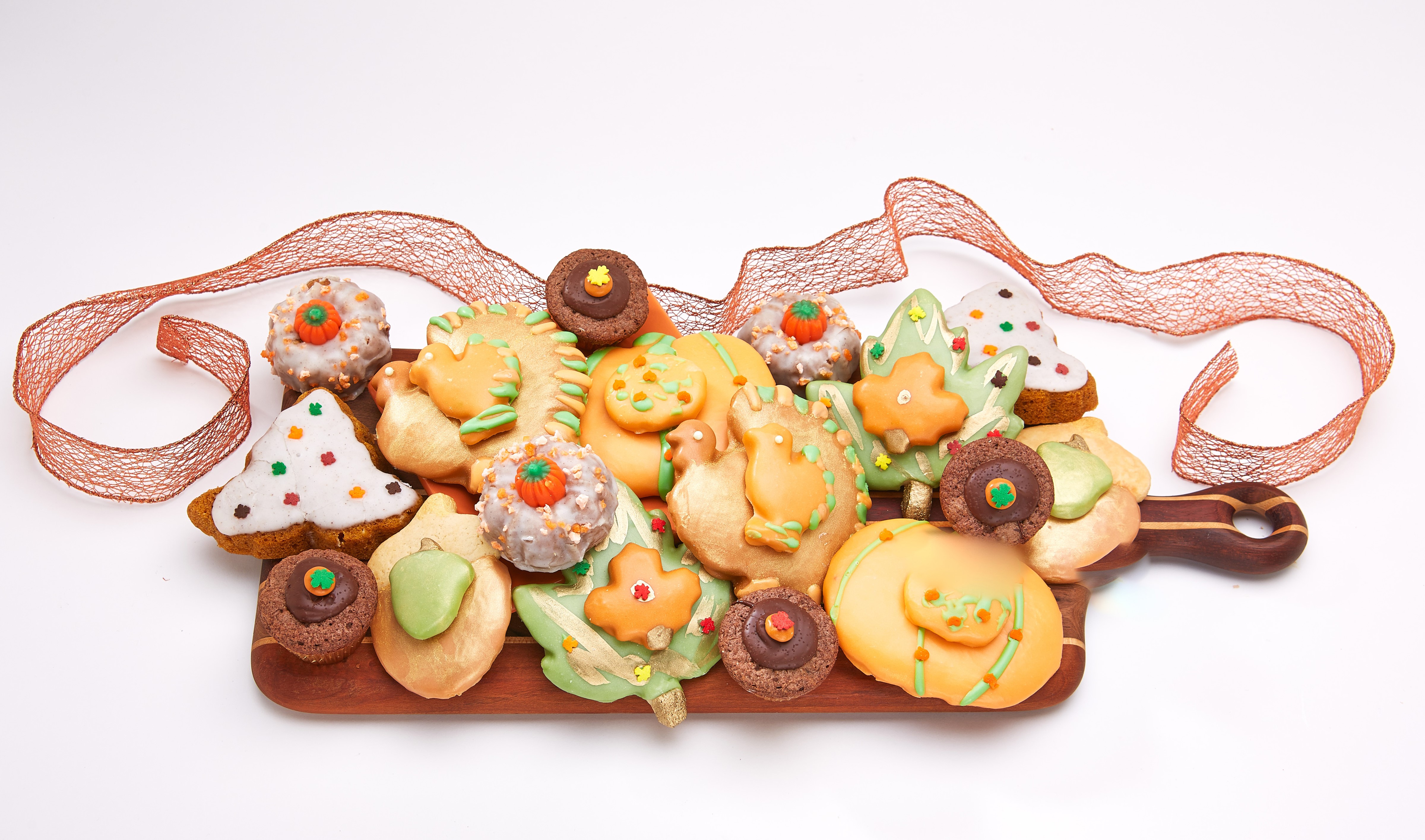 Assortment of Fall-themed Cookies on a Cutting Board with Ribbon HD Wallpaper