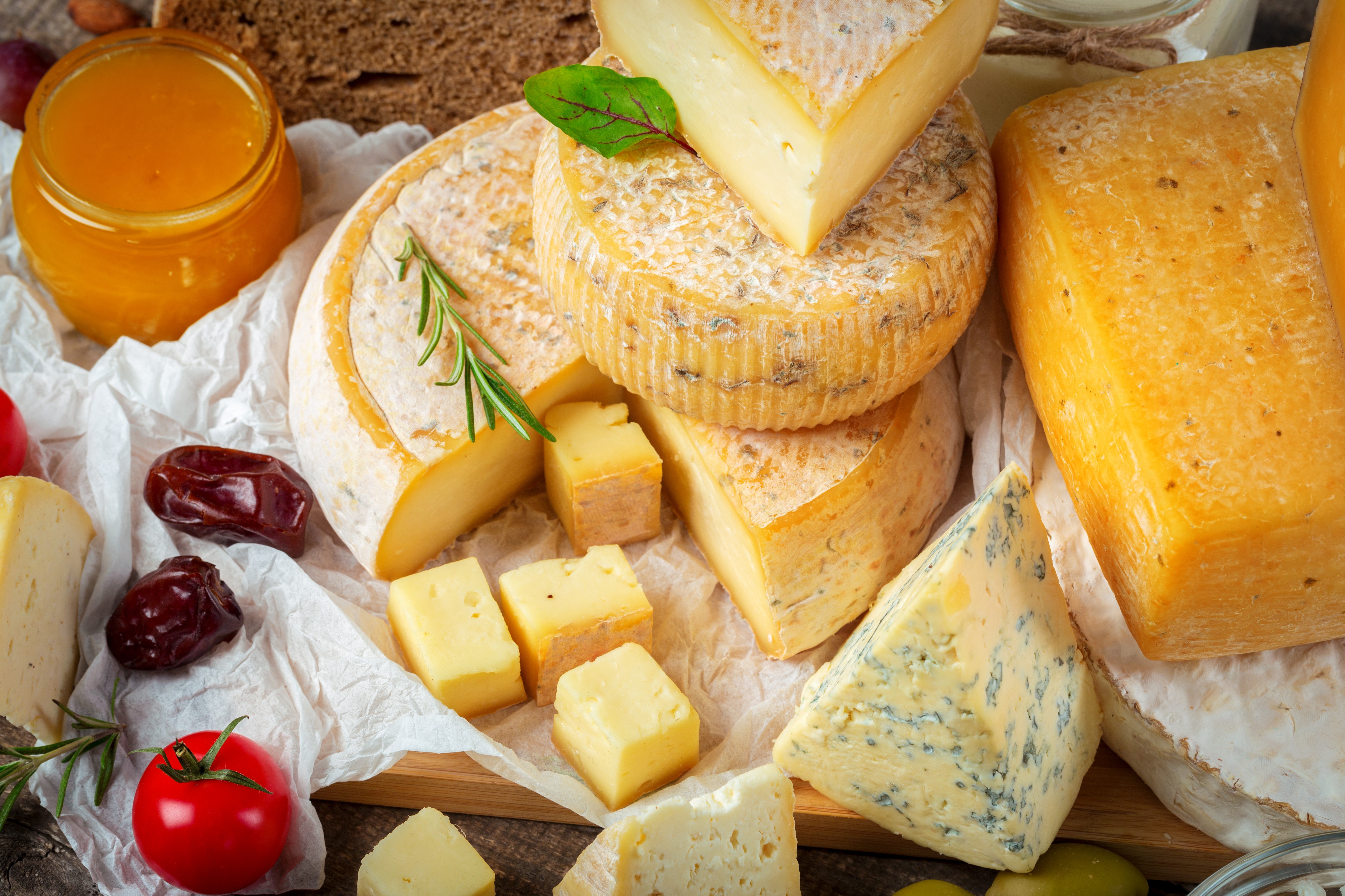 Assortment of Cheeses with Honey and Dates HD Wallpaper