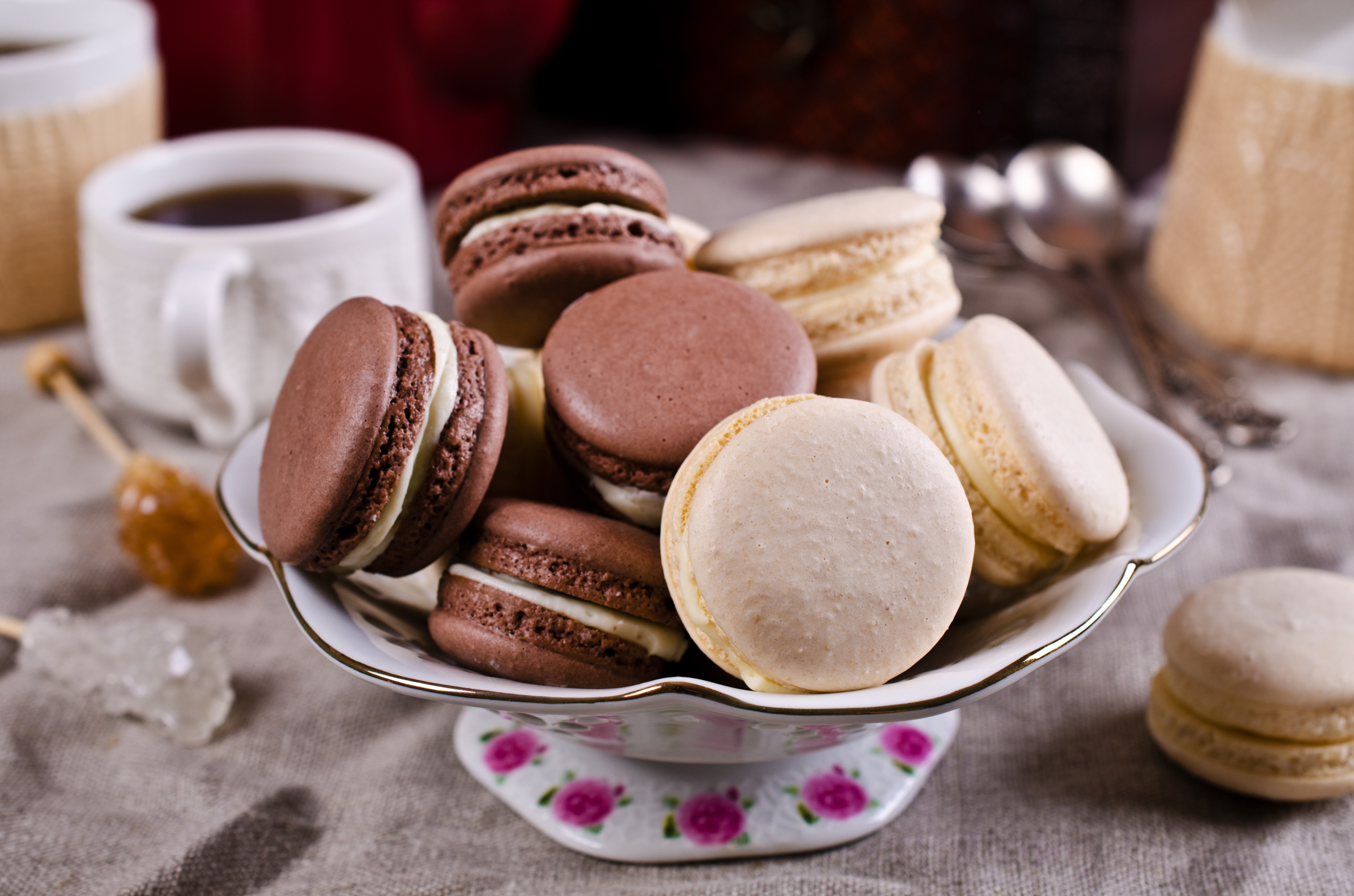 Chocolate and Vanilla Macarons on a Pedestal HD Wallpaper