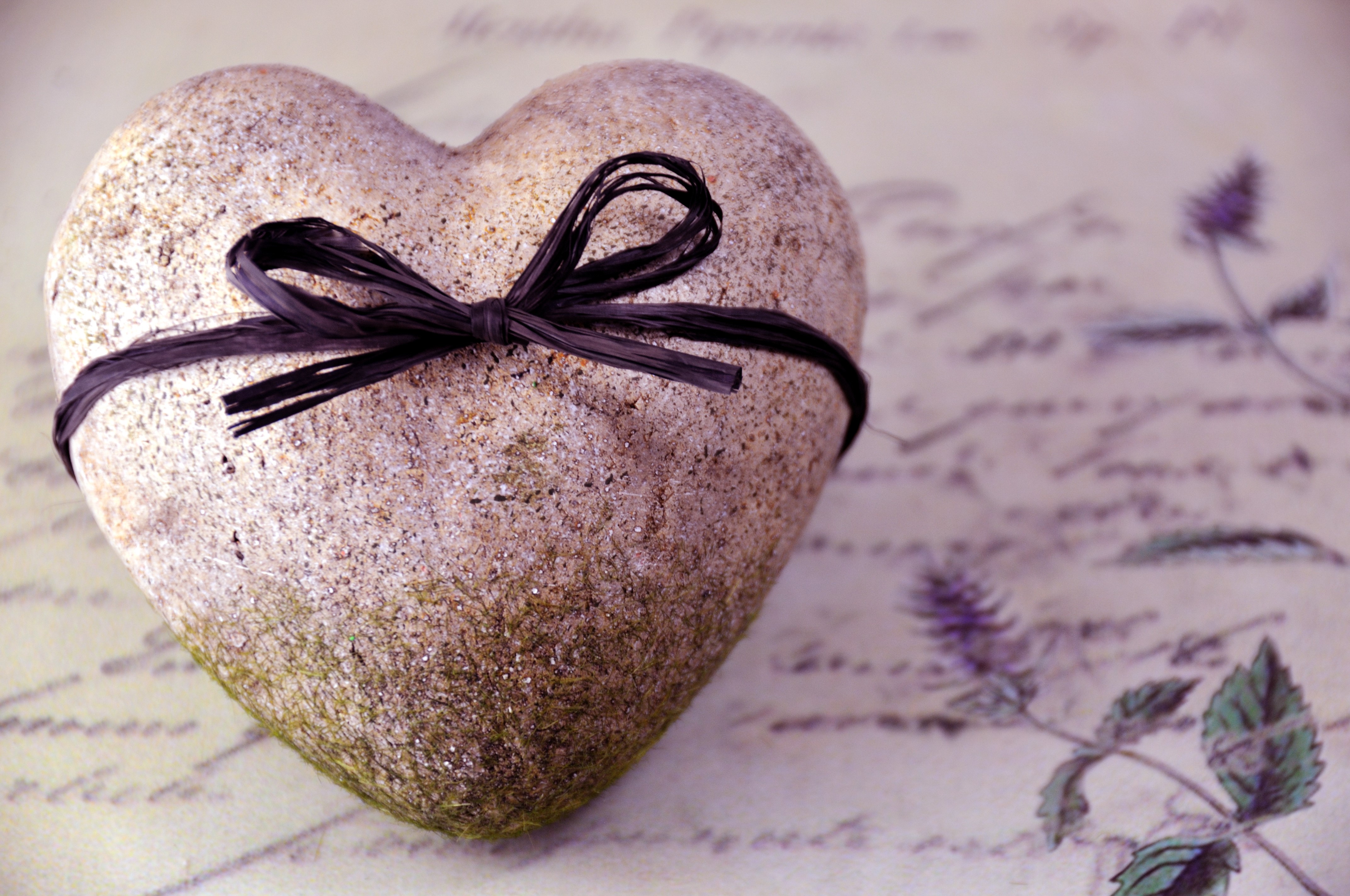 Stone Heart with Black Bow on Script Background HD Wallpaper