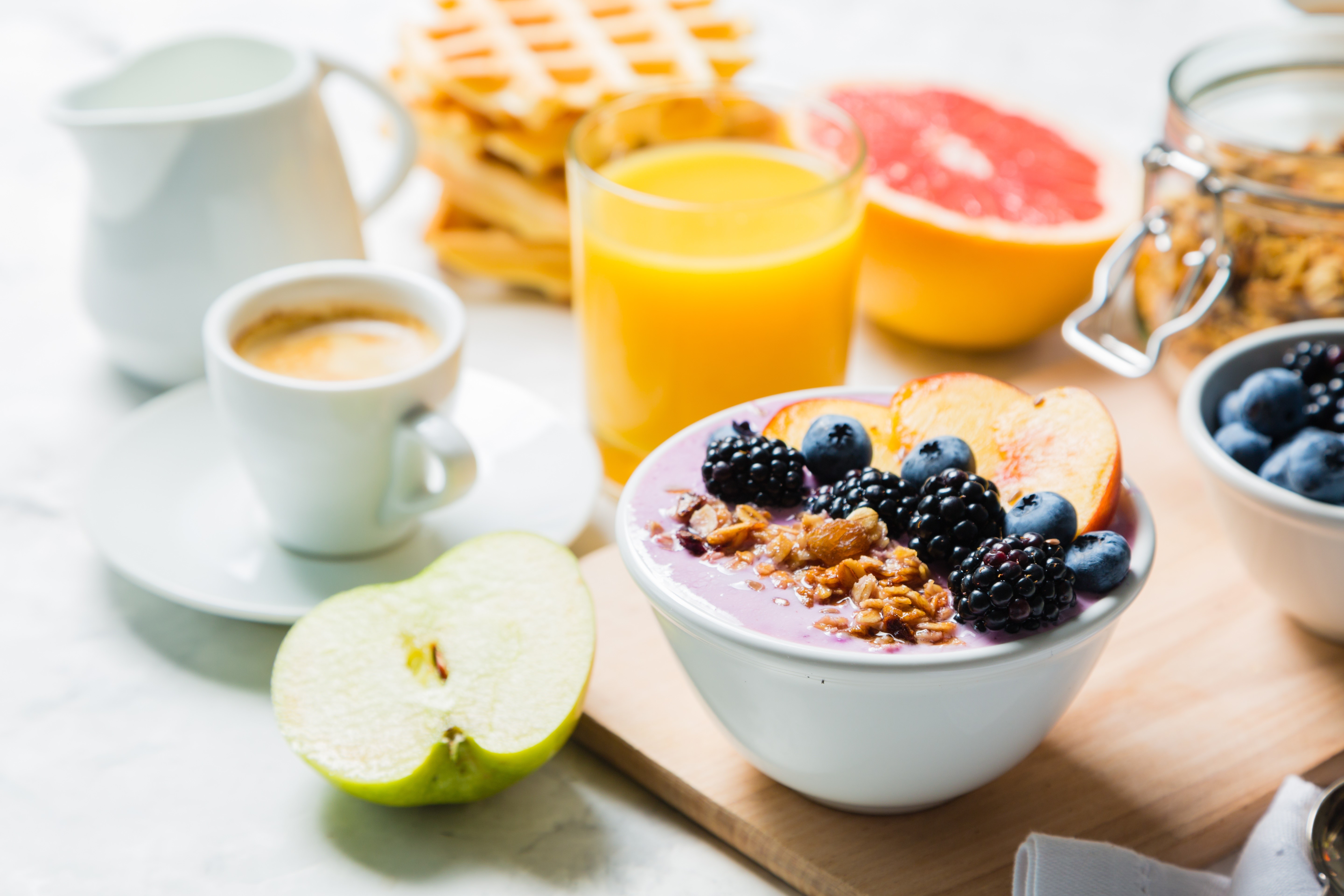 Breakfast with waffles, juice, coffee, and fruit bowl HD Wallpaper