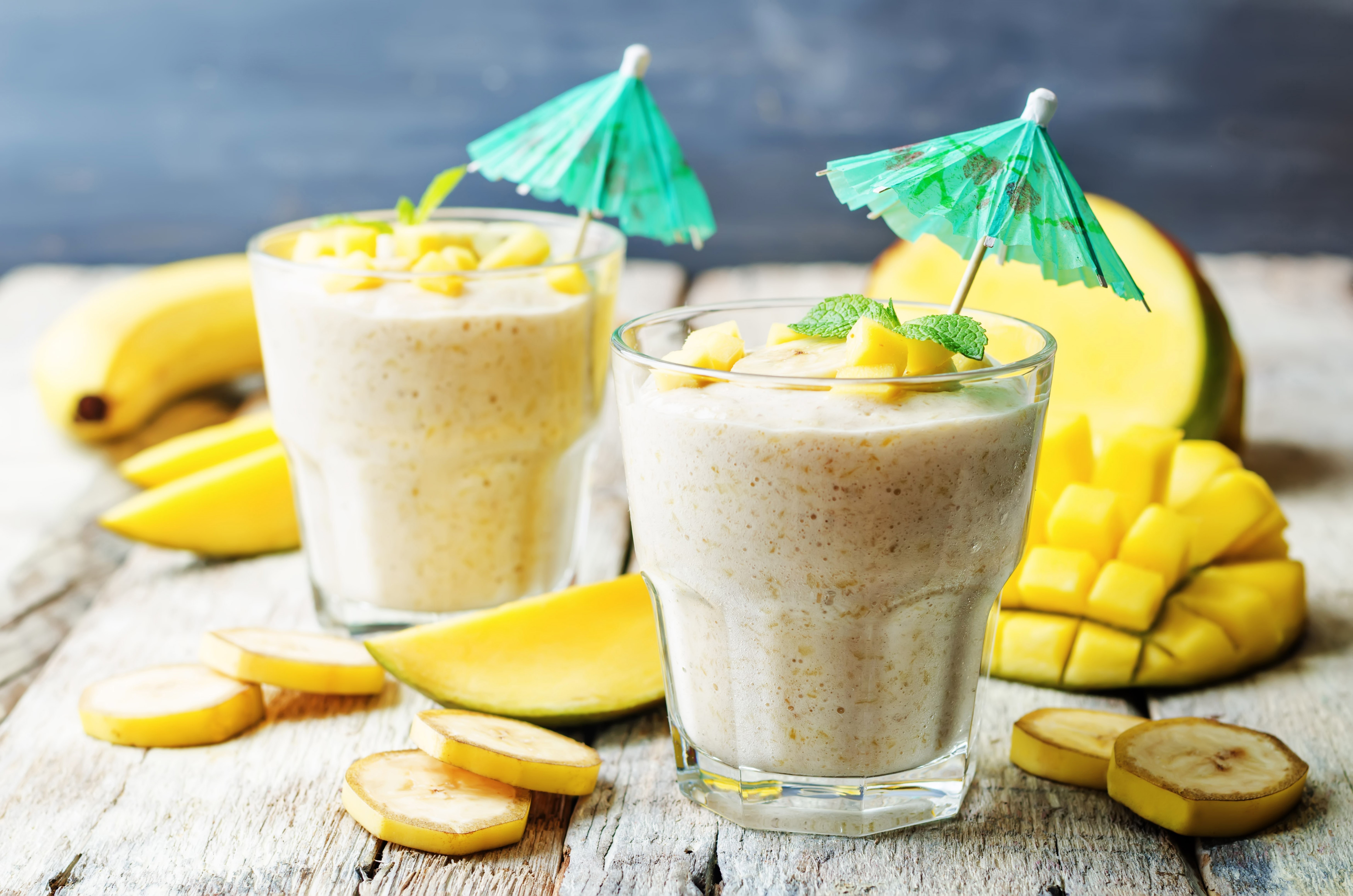 Banana Mango Smoothies with Fruit and Umbrellas HD Wallpaper
