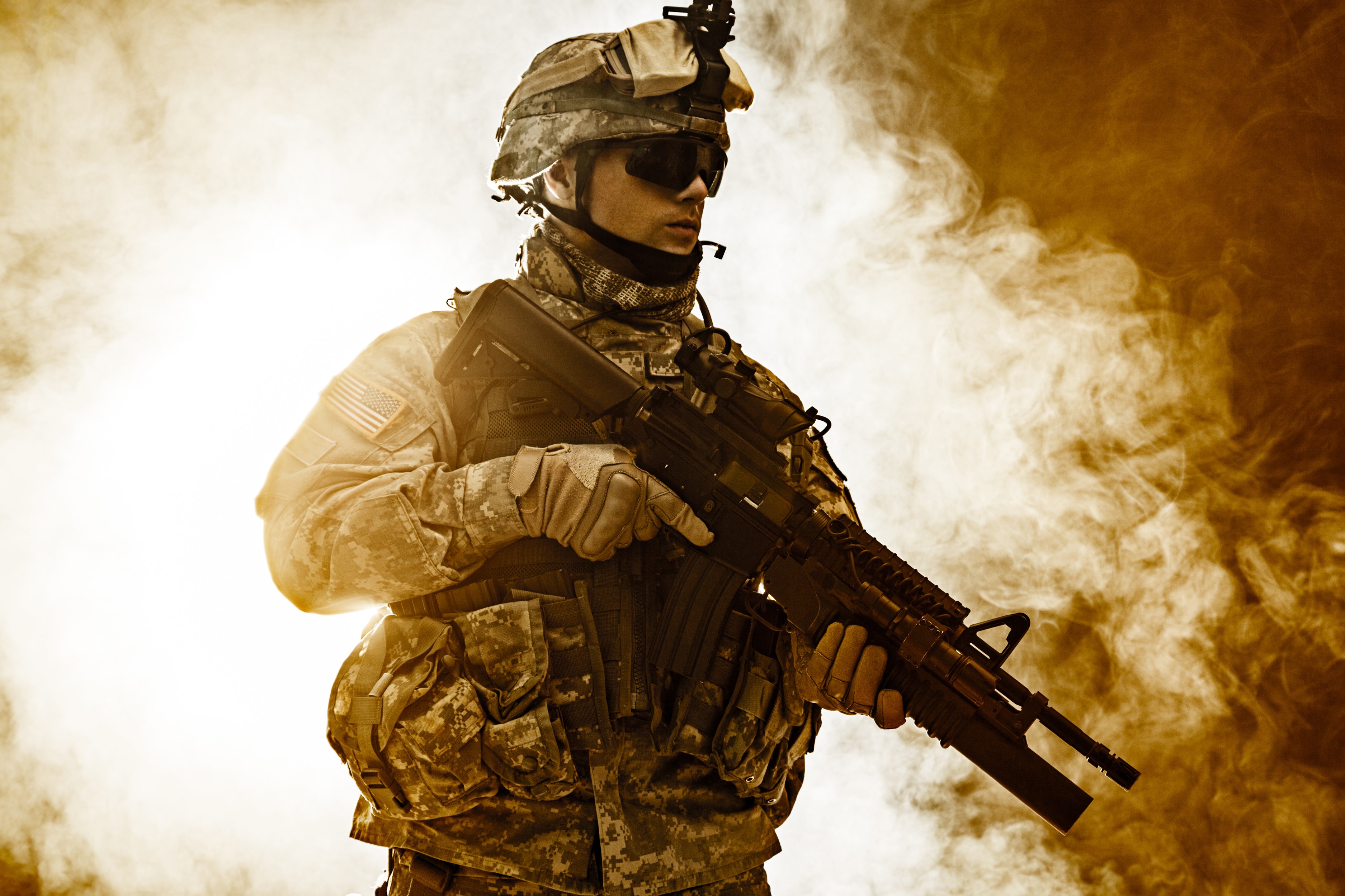 Soldier in uniform holding an assault rifle HD Wallpaper