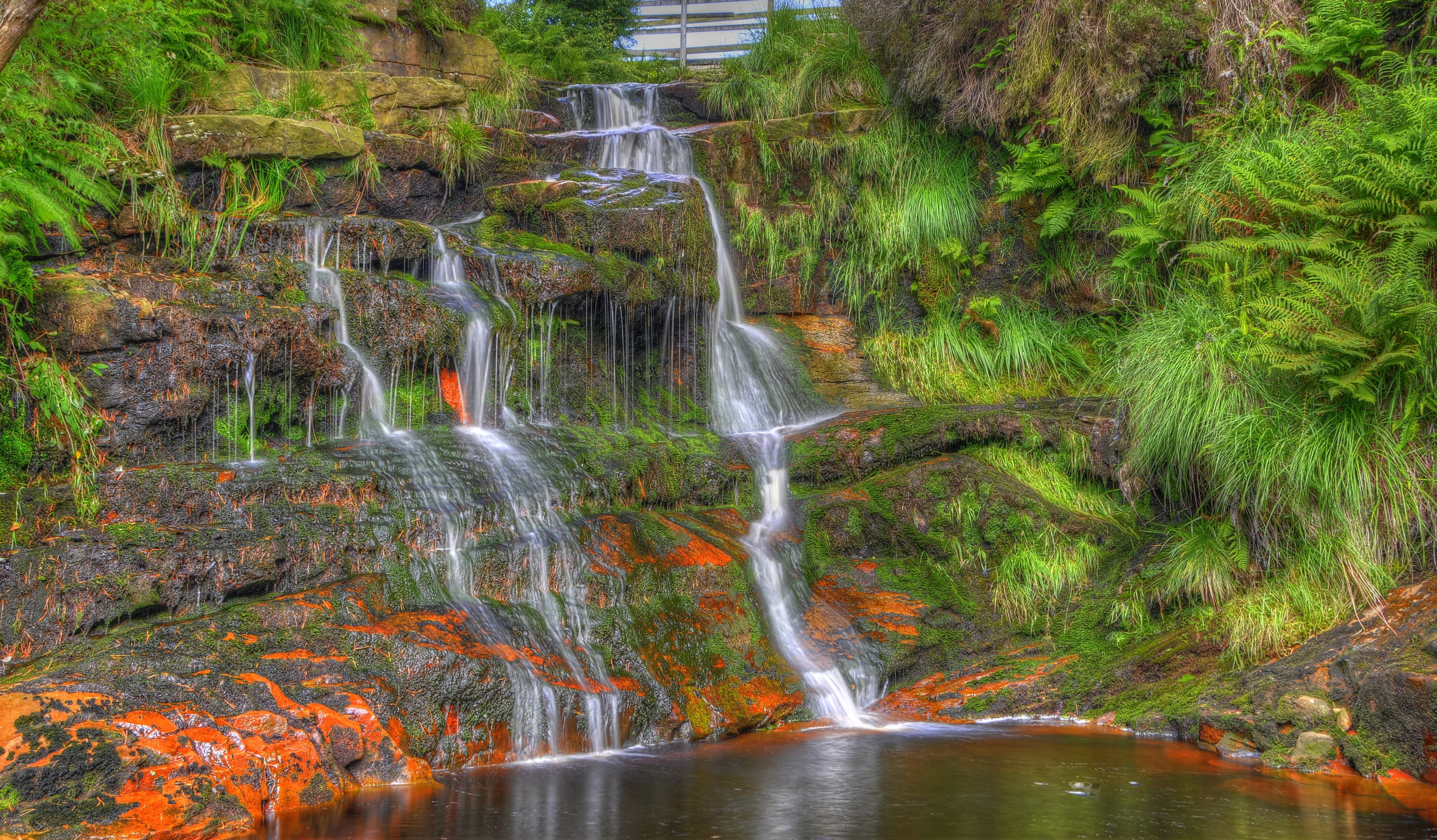 Waterfalls cascading over mossy rocks in Lancashire, England HD Wallpaper