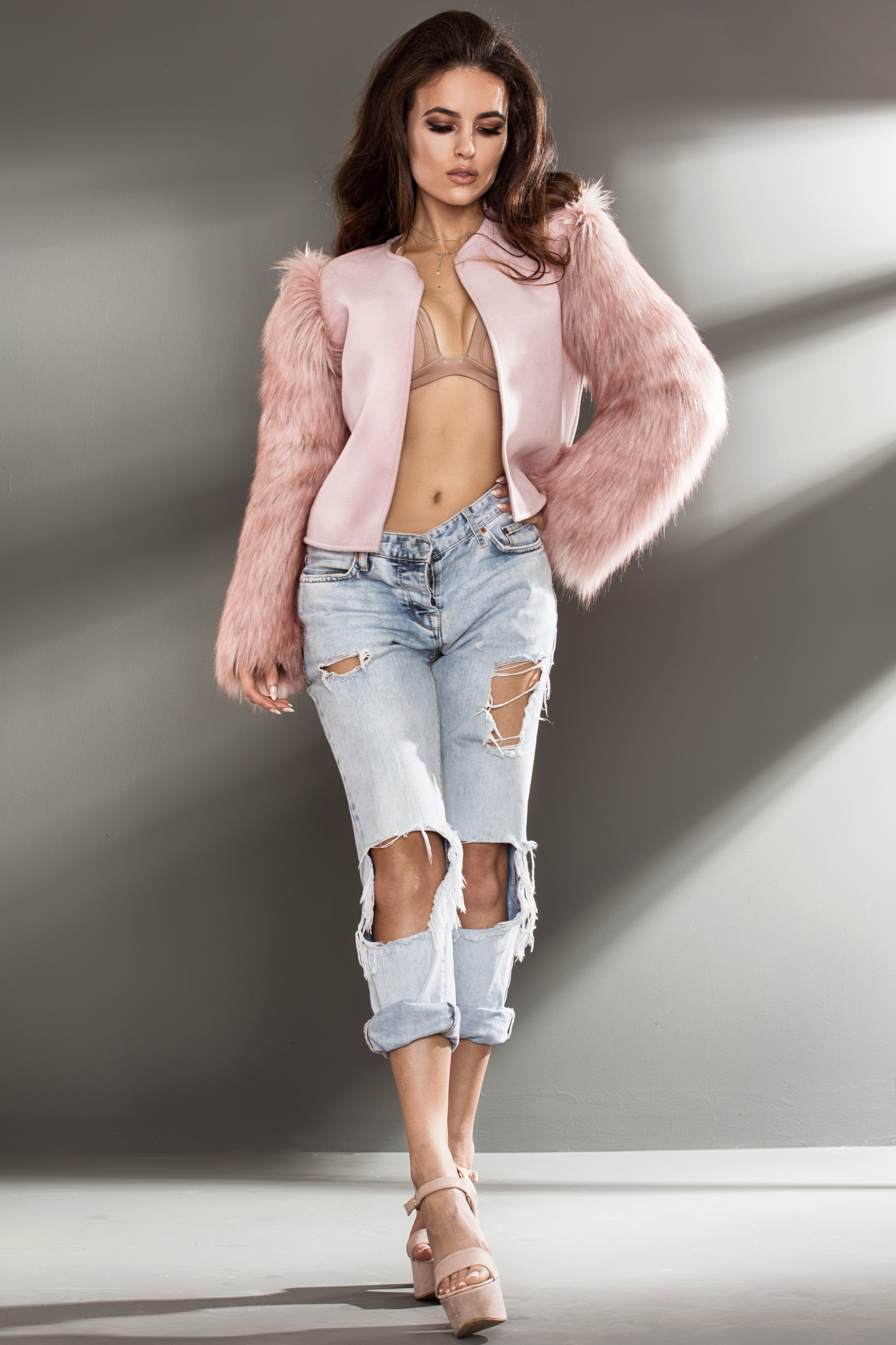 Woman in pink jacket and ripped jeans HD Phone Wallpaper