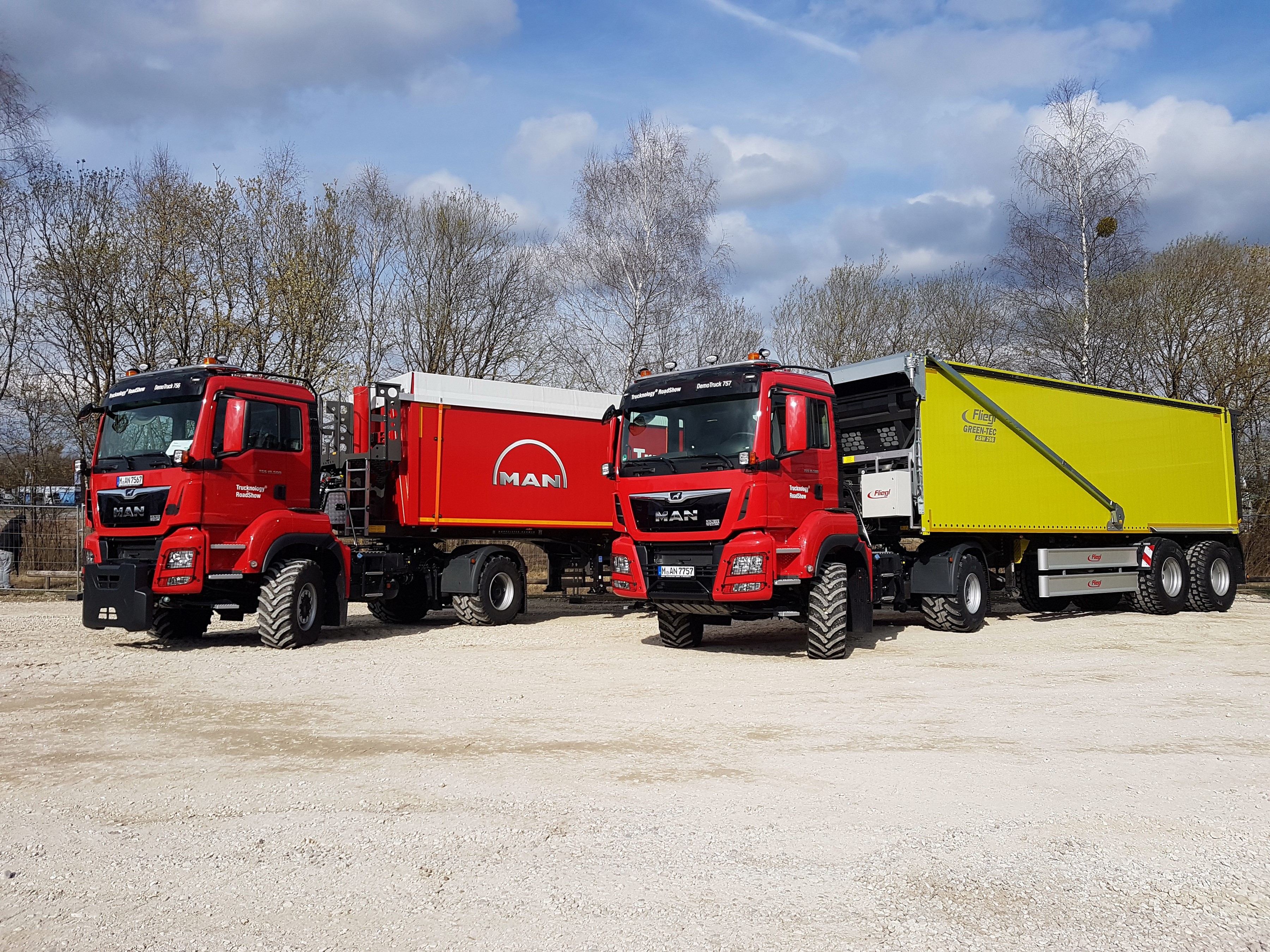 Two red MAN trucks with trailers HD Wallpaper