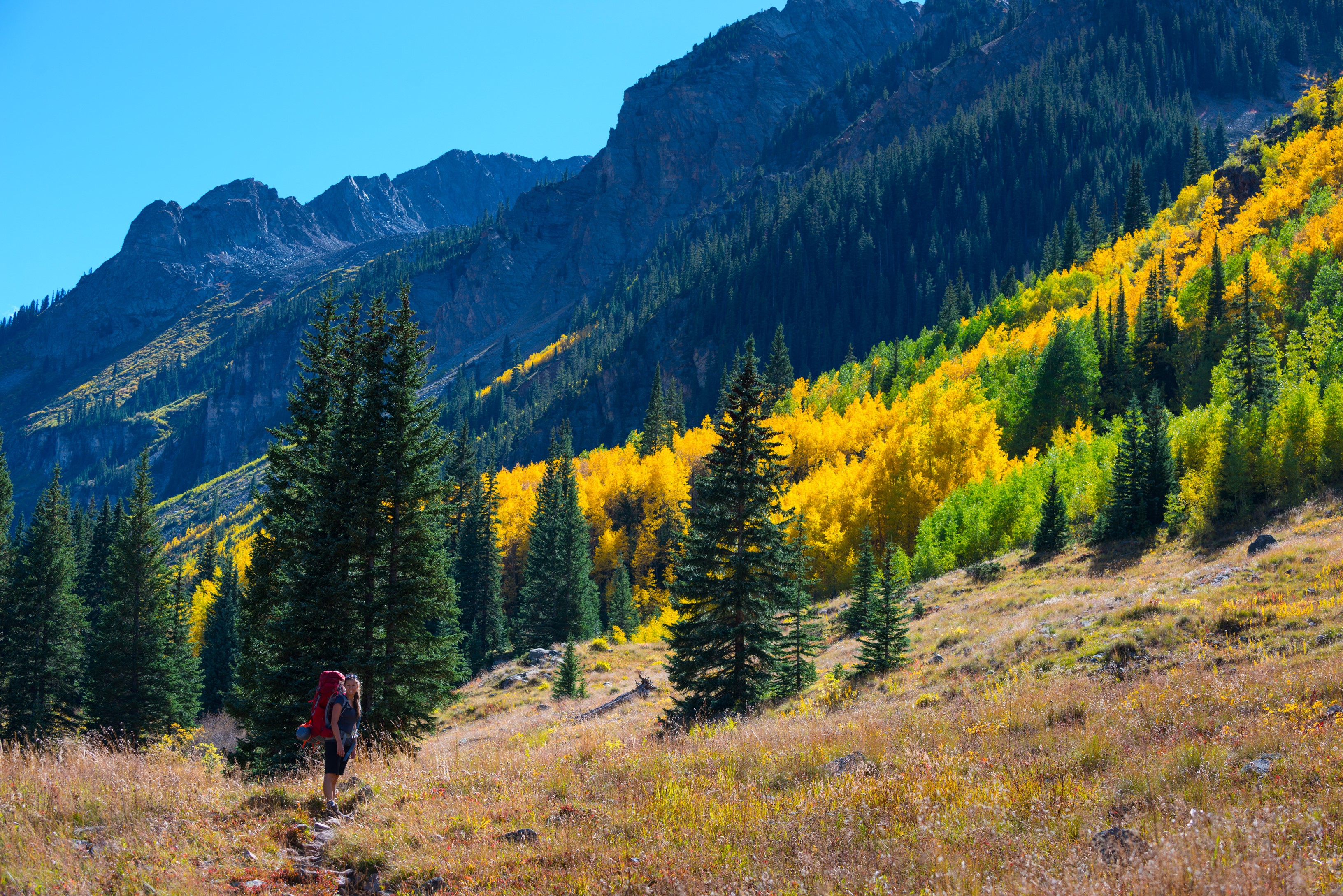 Hiker in Colorado Mountains during Autumn HD Wallpaper