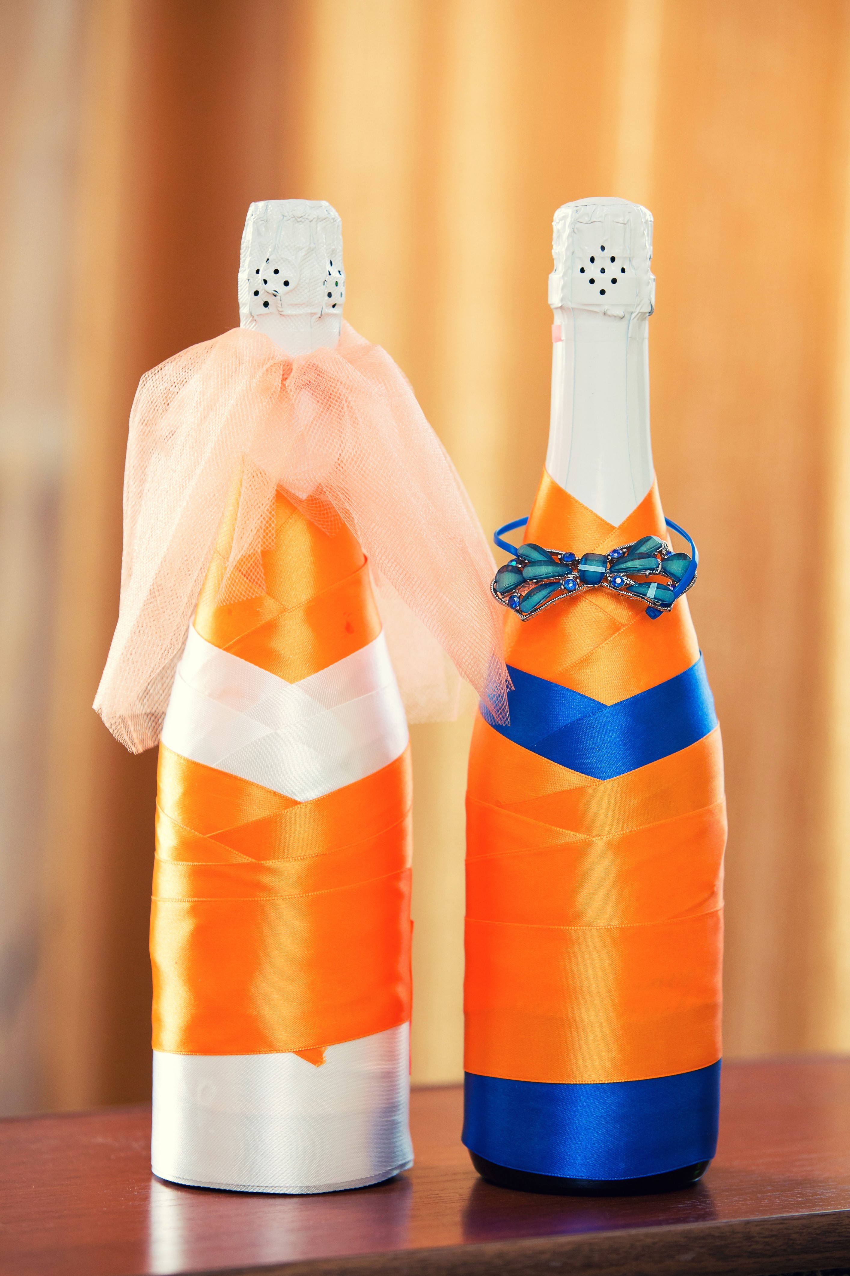 Two champagne bottles decorated with ribbons HD Phone Wallpaper
