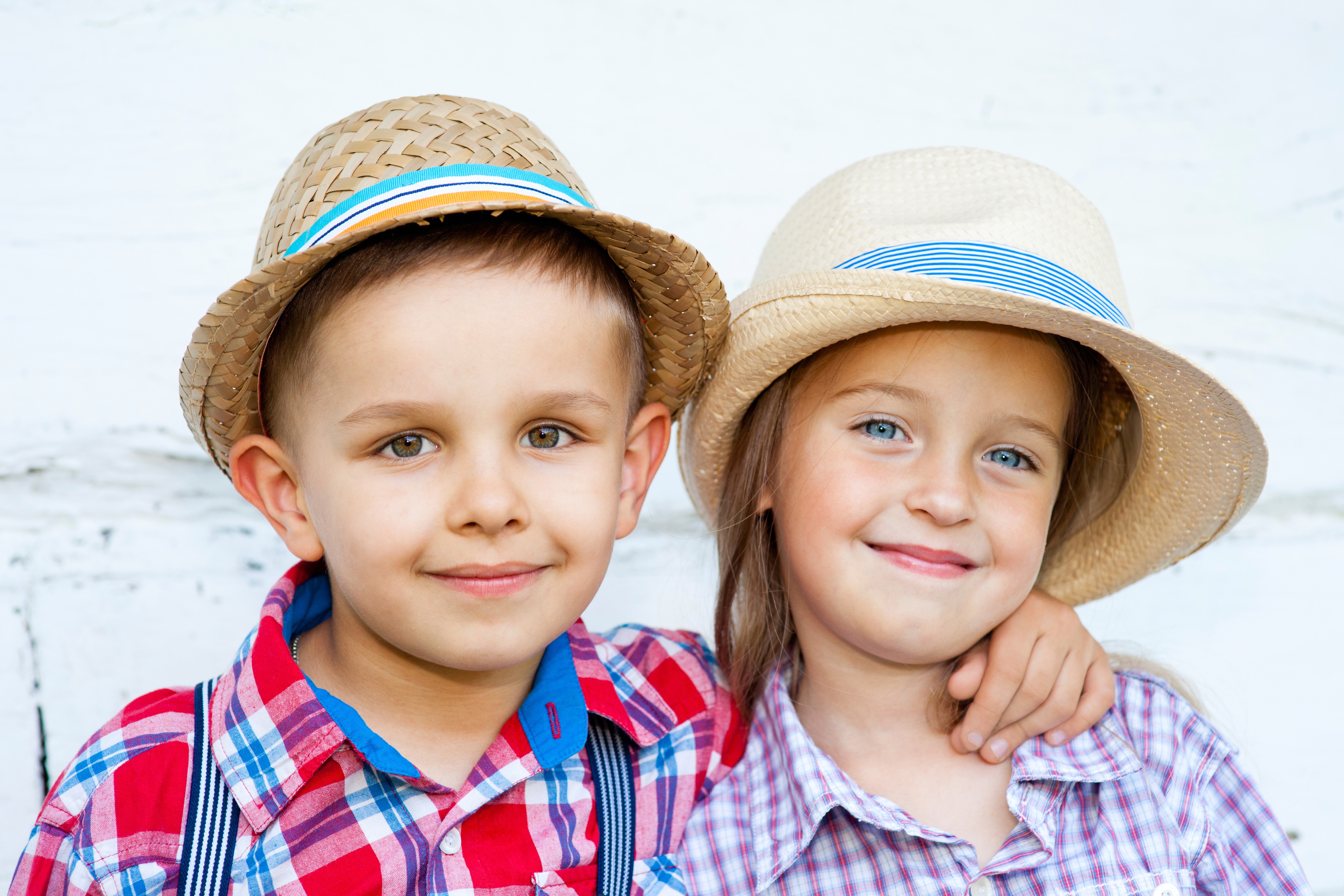 Two children wearing hats HD Wallpaper