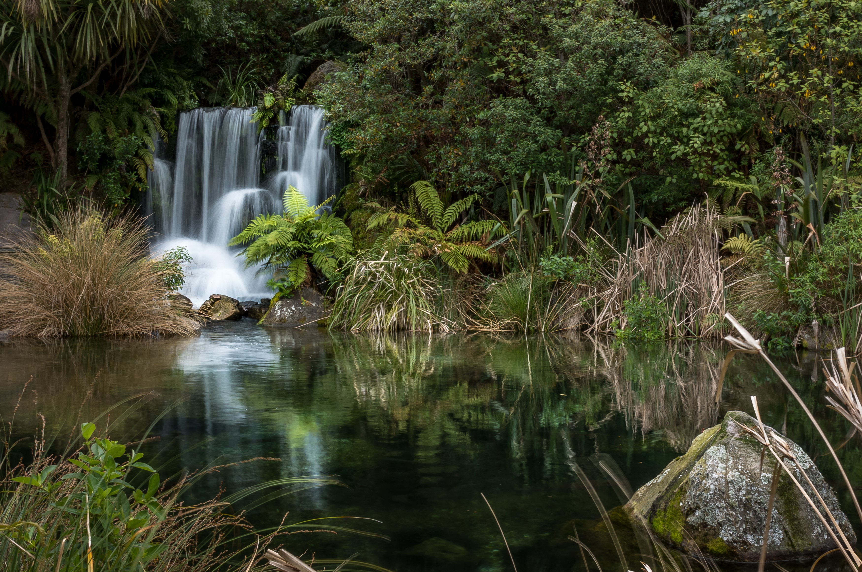 Waterfall in a New Zealand Park with Stones HD Wallpaper
