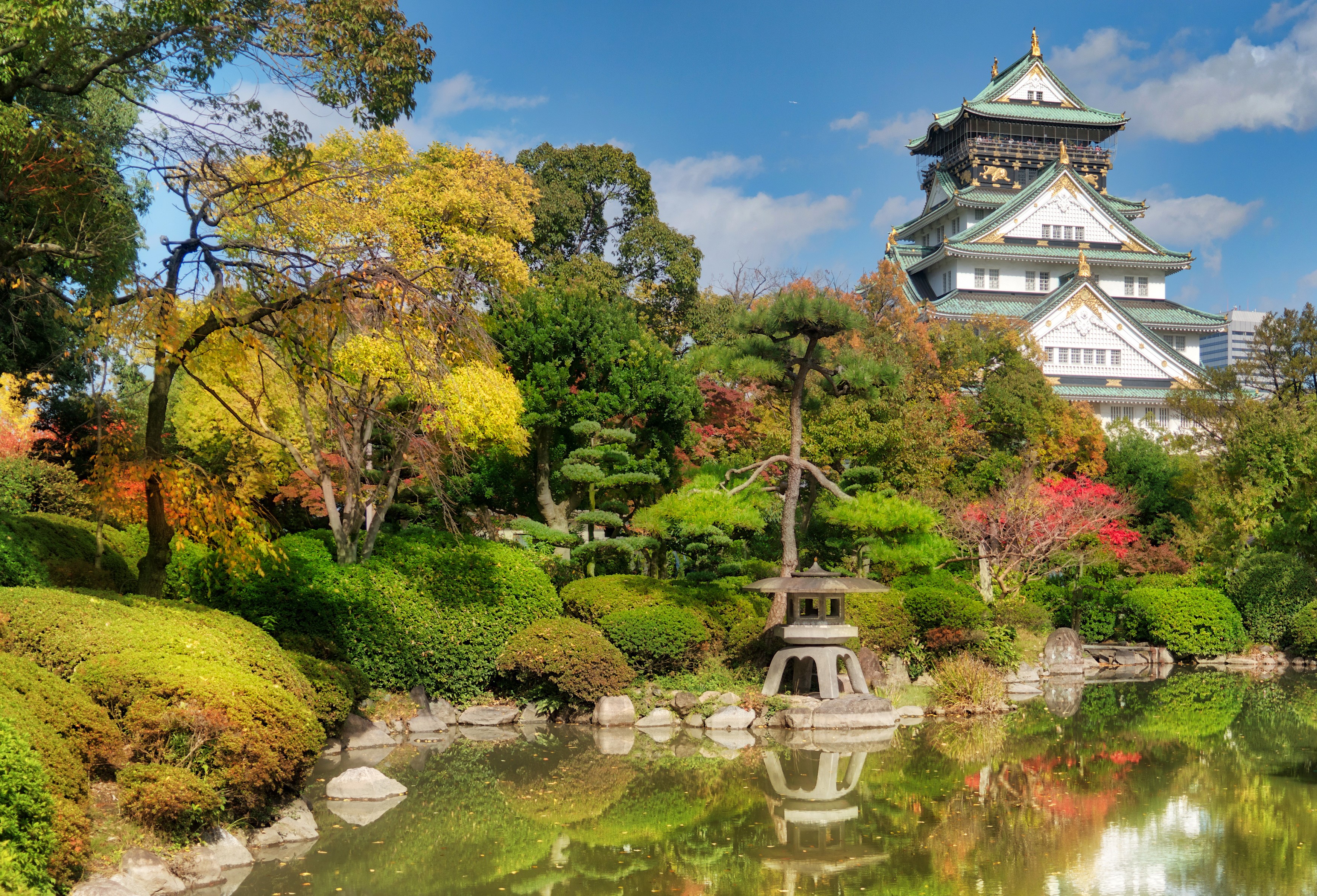 Osaka Castle park in Autumn with a pond and trees HD Wallpaper