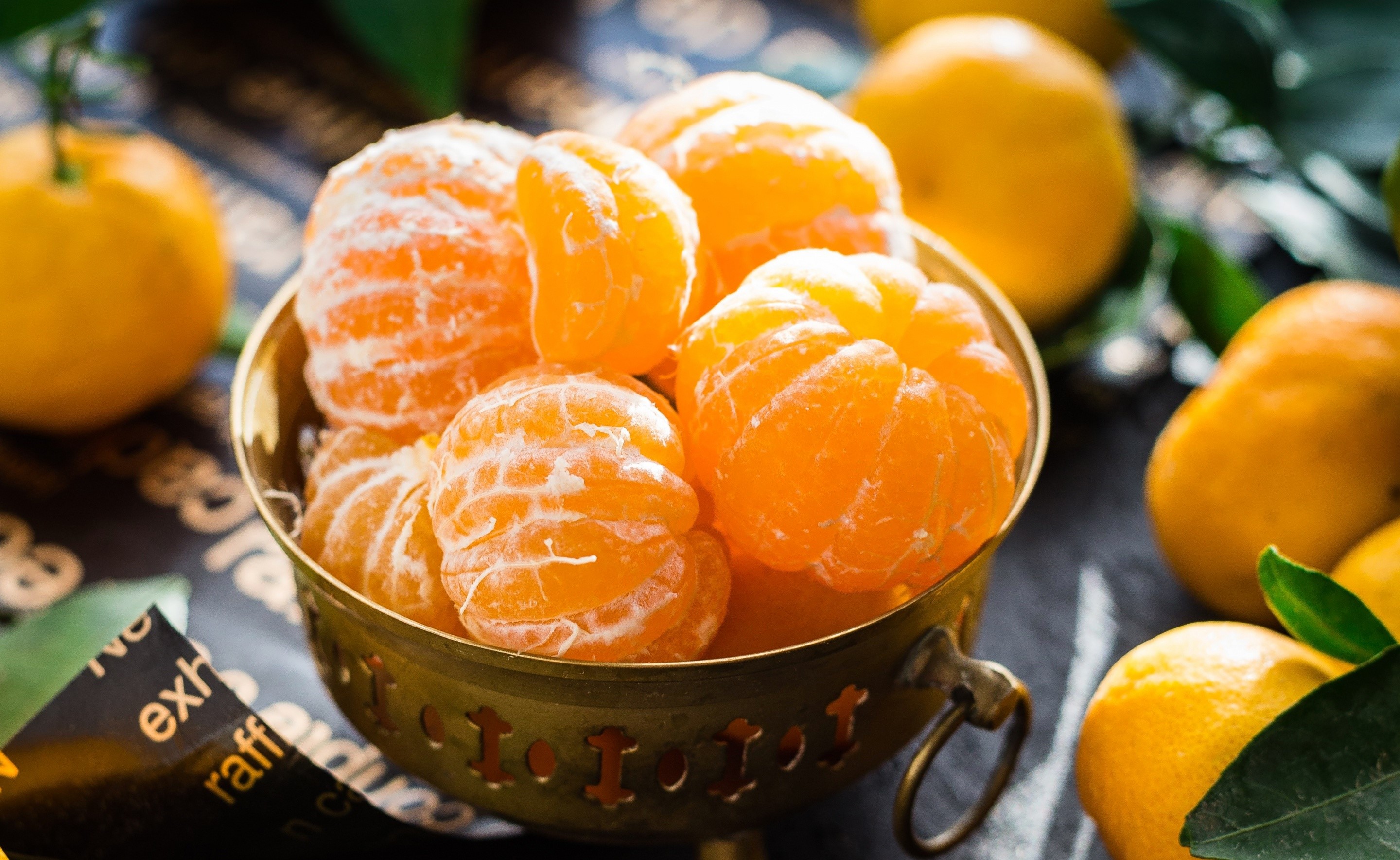 Peeled mandarins in a decorative bowl HD Wallpaper