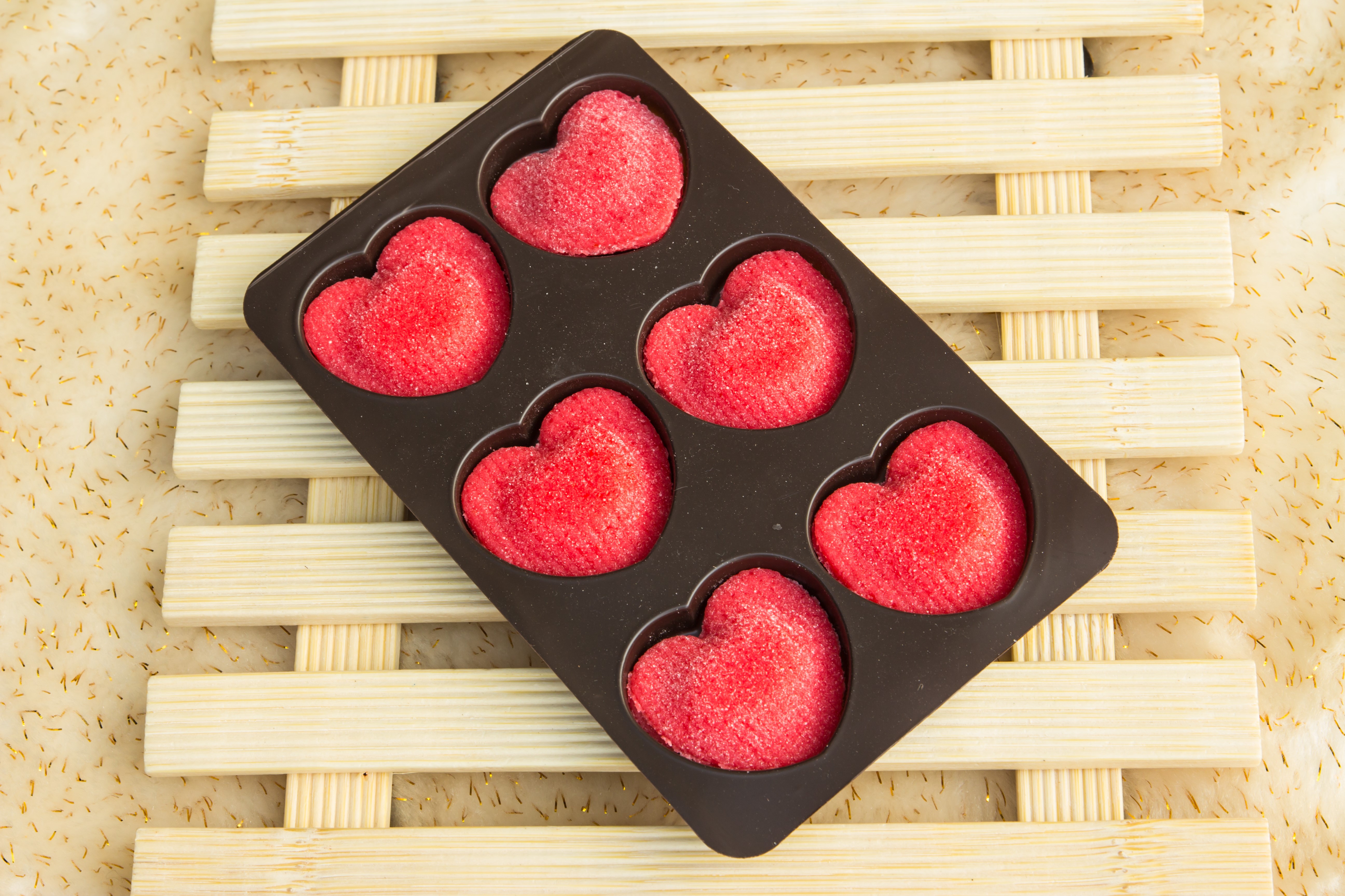 Heart-shaped candies in a tray HD Wallpaper
