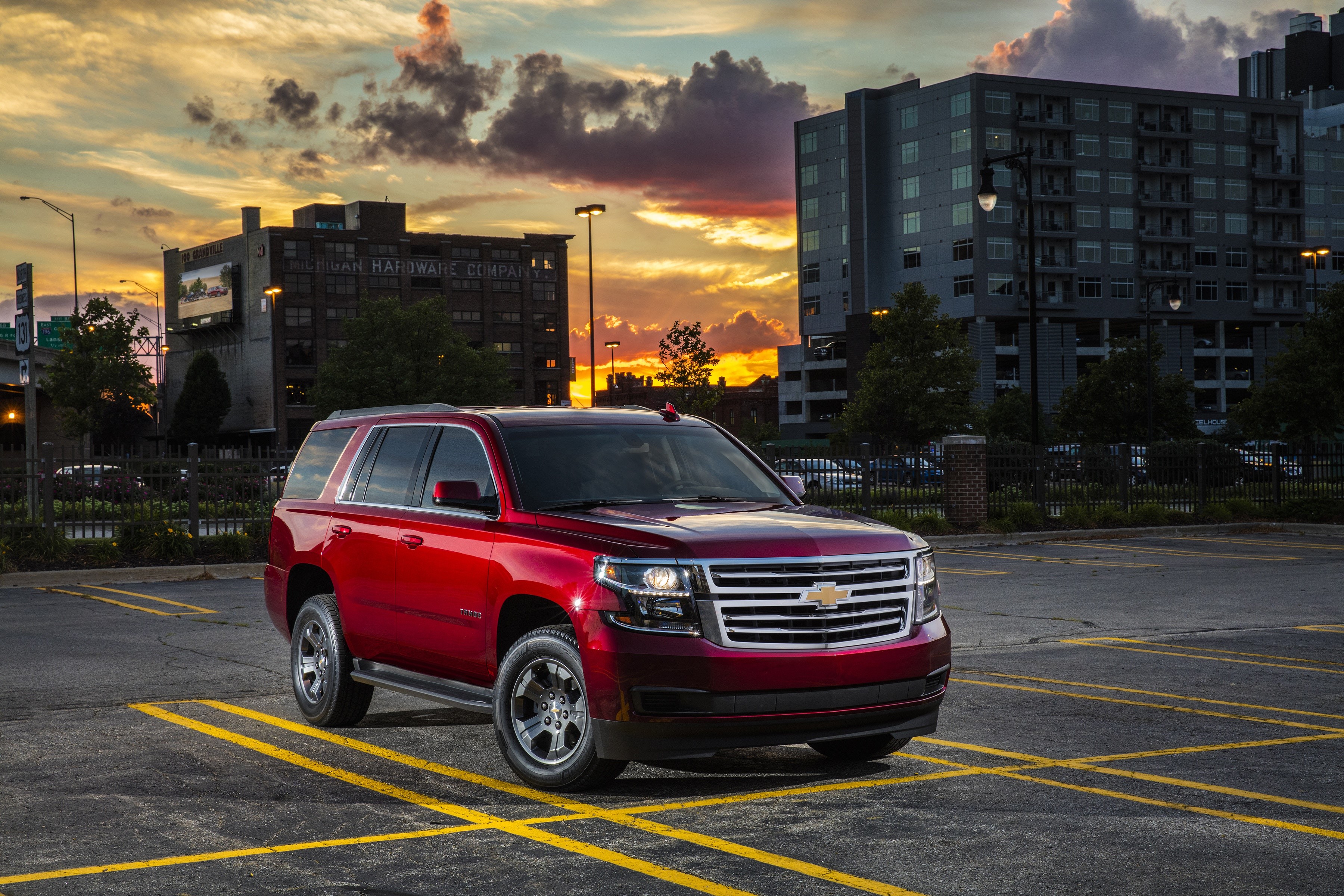 Red 2018 Chevrolet Tahoe SUV in Parking Lot HD Wallpaper
