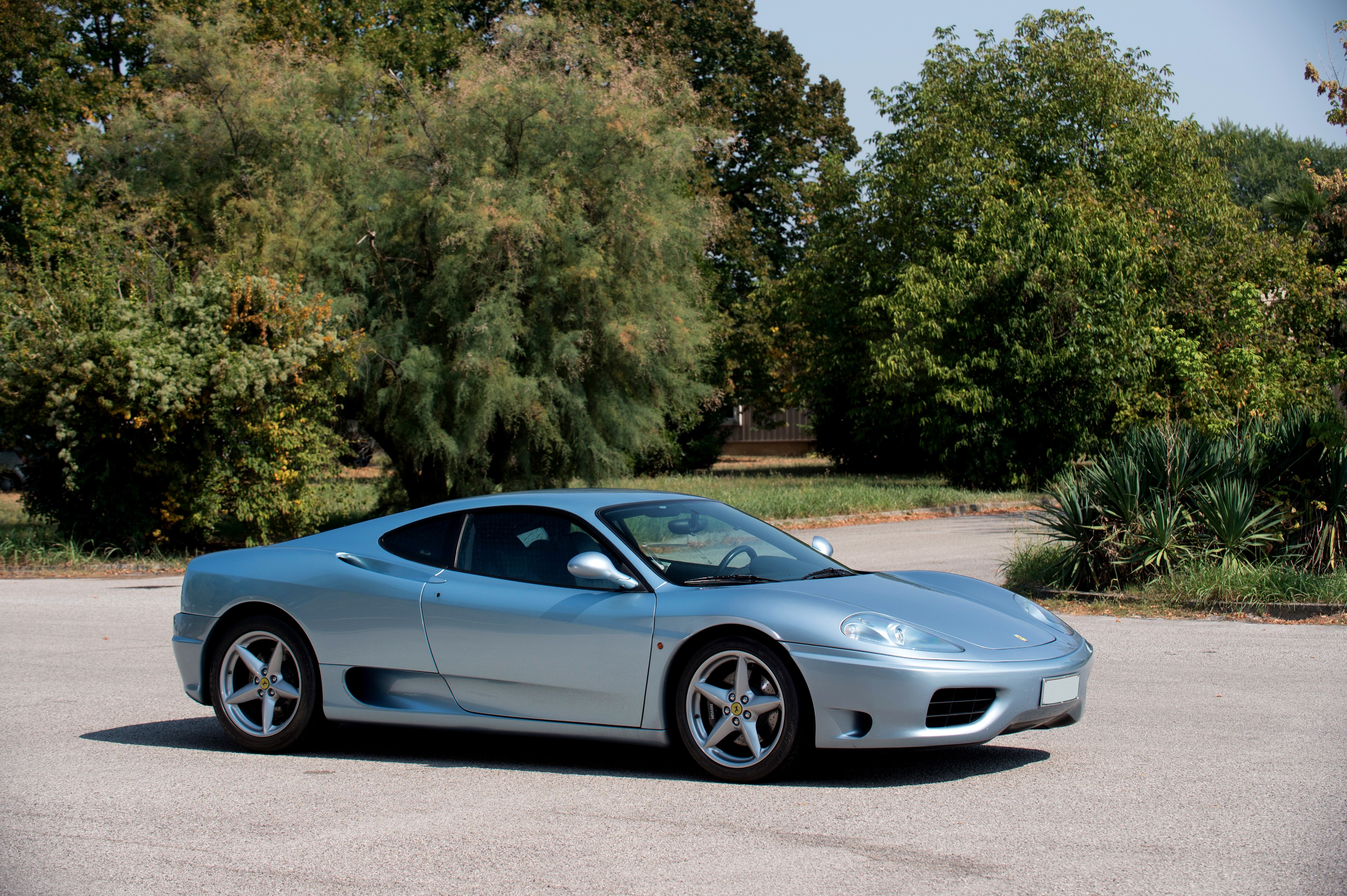Silver Ferrari 360 Modena parked outdoors HD Wallpaper