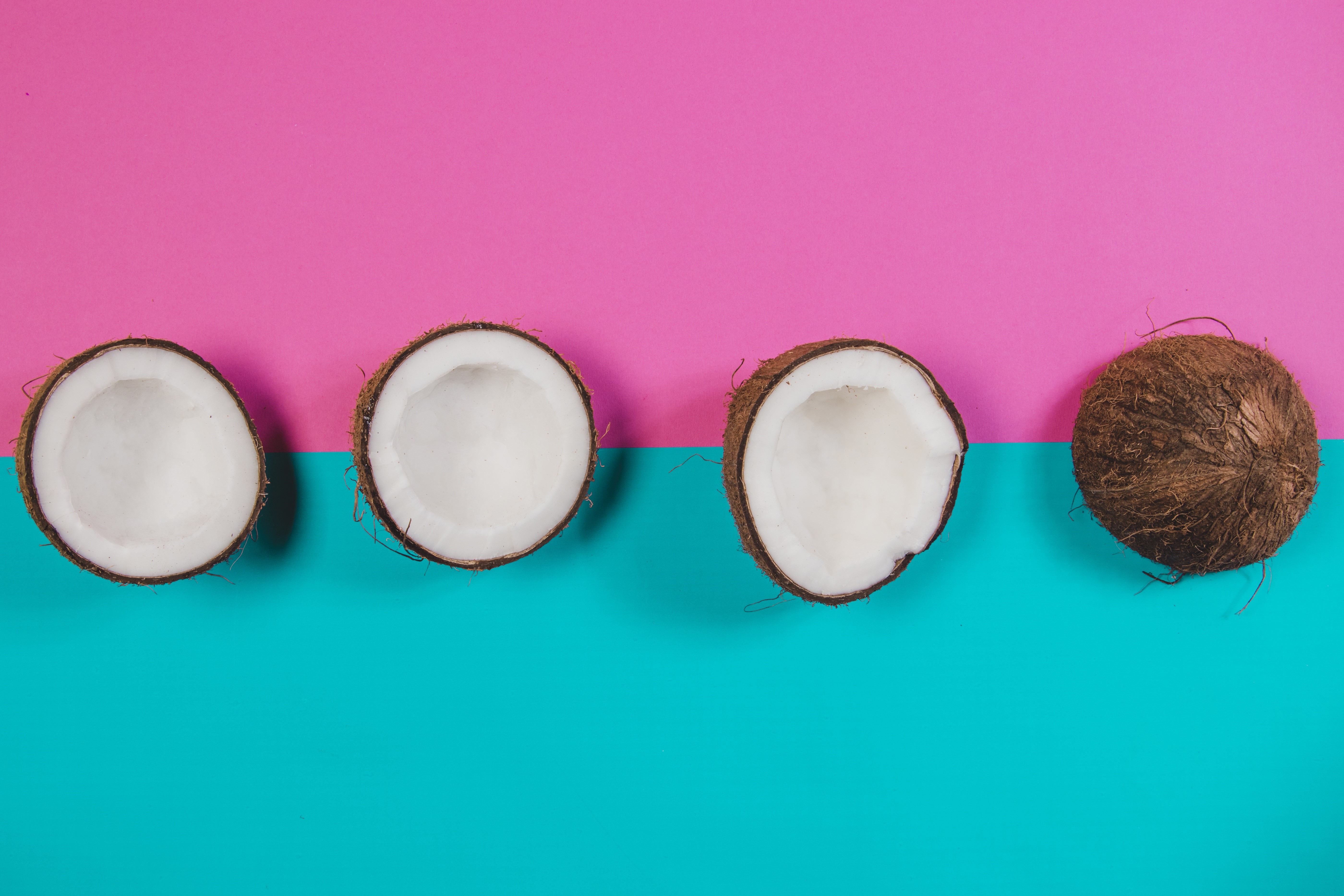 Coconuts on pink and turquoise background HD Wallpaper