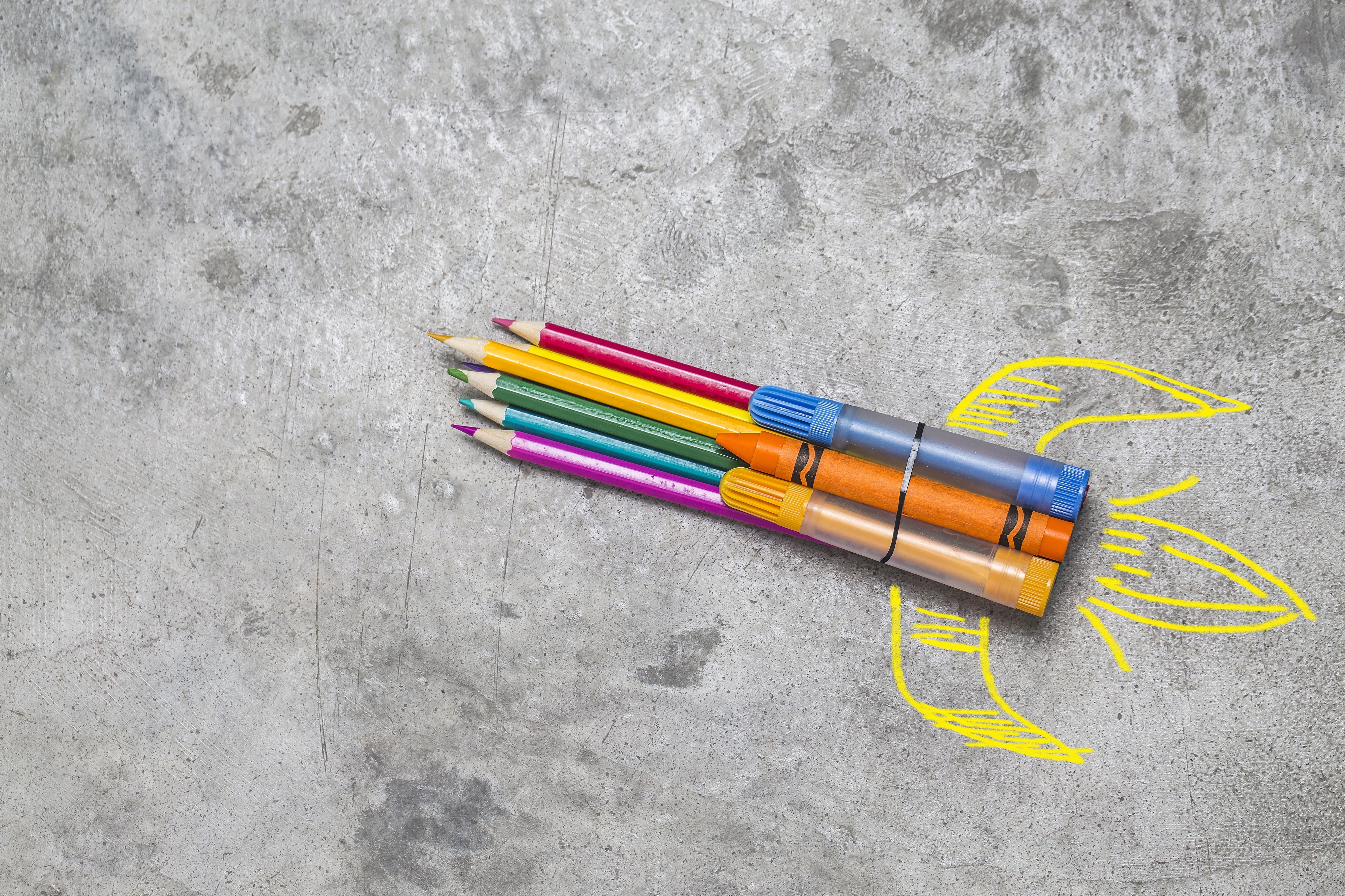 Rocket made of pencils and crayons with yellow flame drawing HD Wallpaper