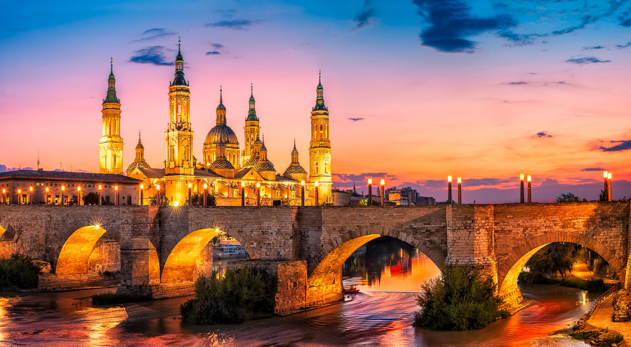 Basilica of Our Lady of the Pillar and Stone Bridge at Dusk HD Wallpaper